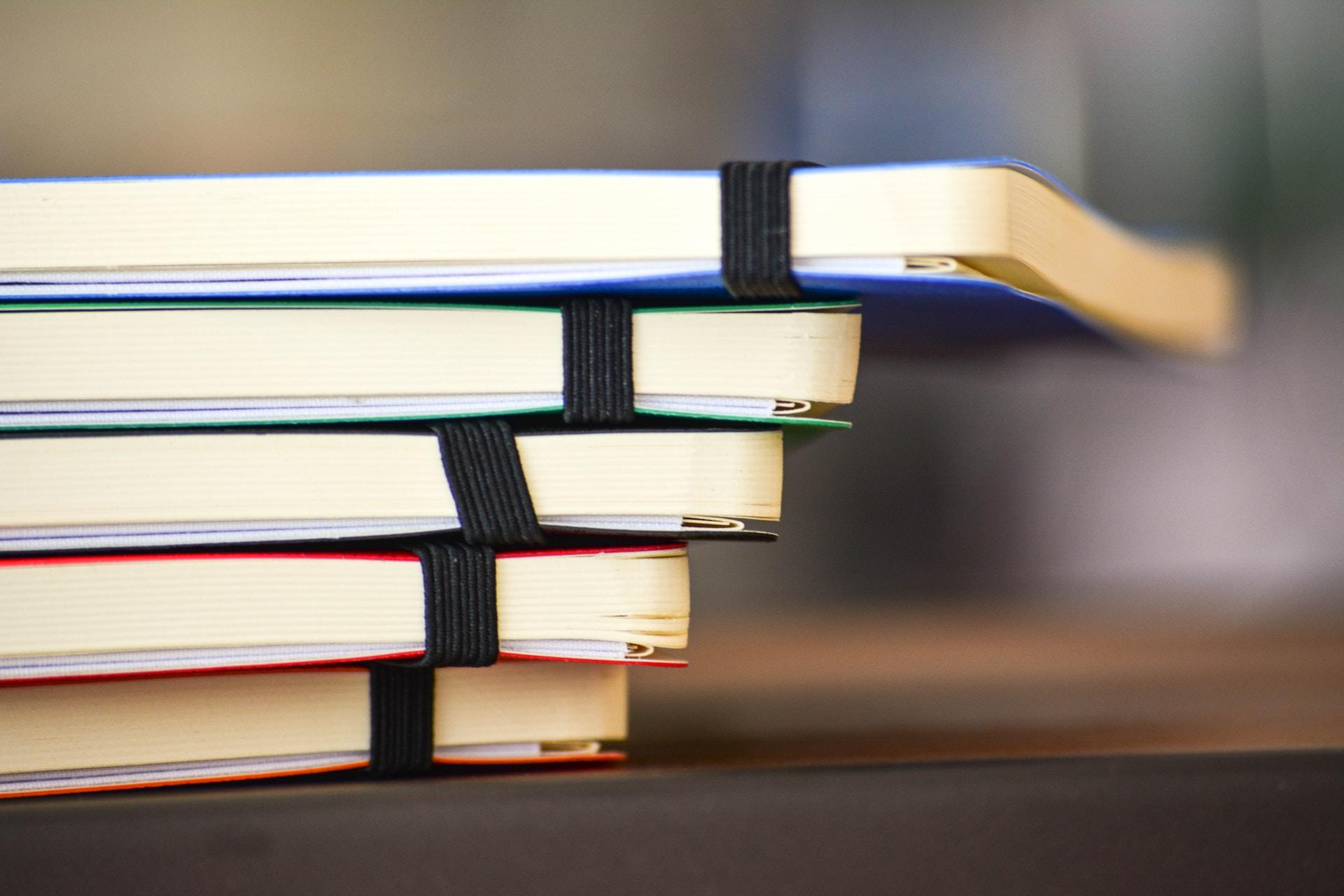 A number of coloured notebook
