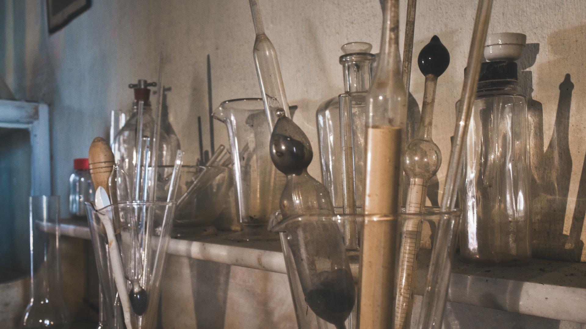 Various types of antique chemistry glassware.