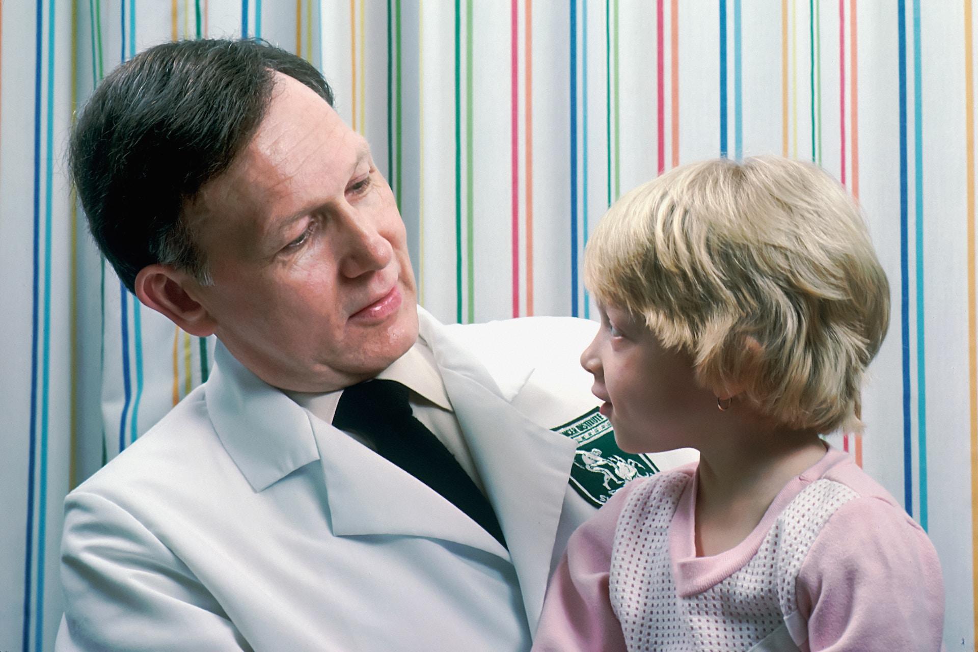 A doctor treating a child.