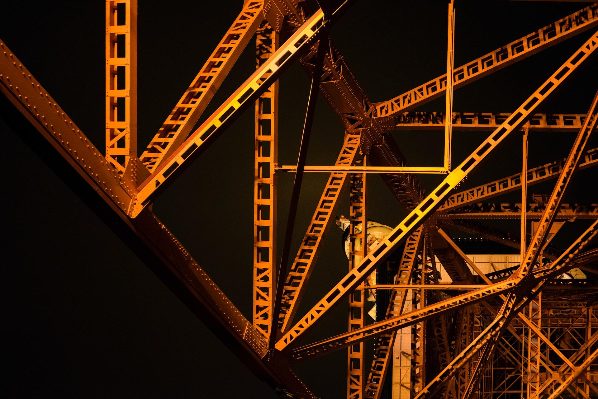 A view of bridge trusses at night
