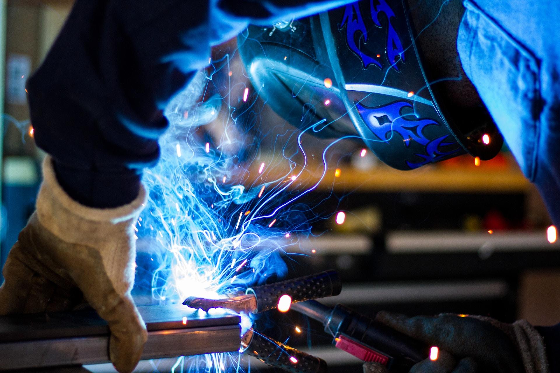 A closeup of a person welding.