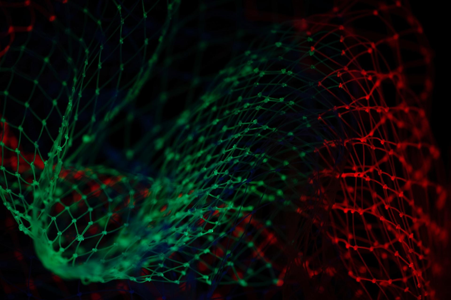 A net lit up with green and red light.