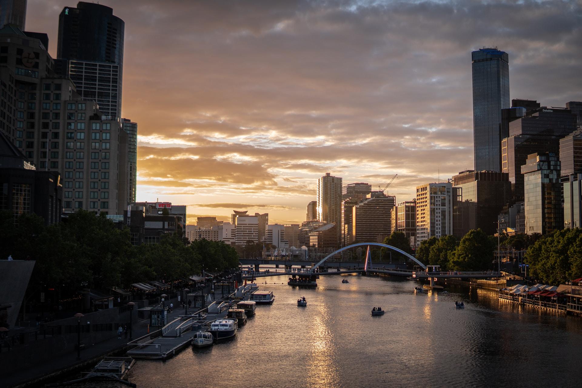 A view of the Melbourne skyline at sunset.