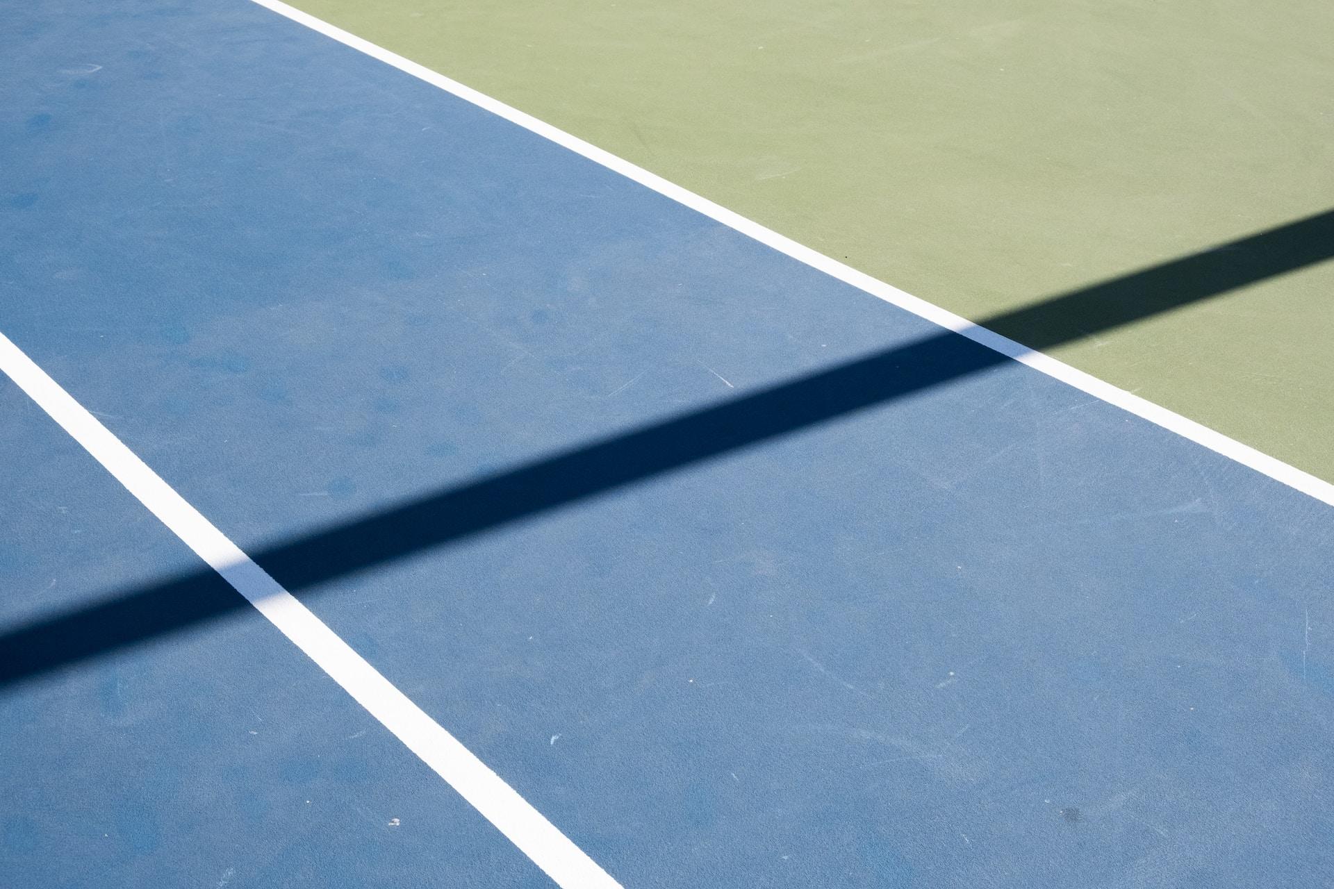 A photo of a hard tennis court surface.