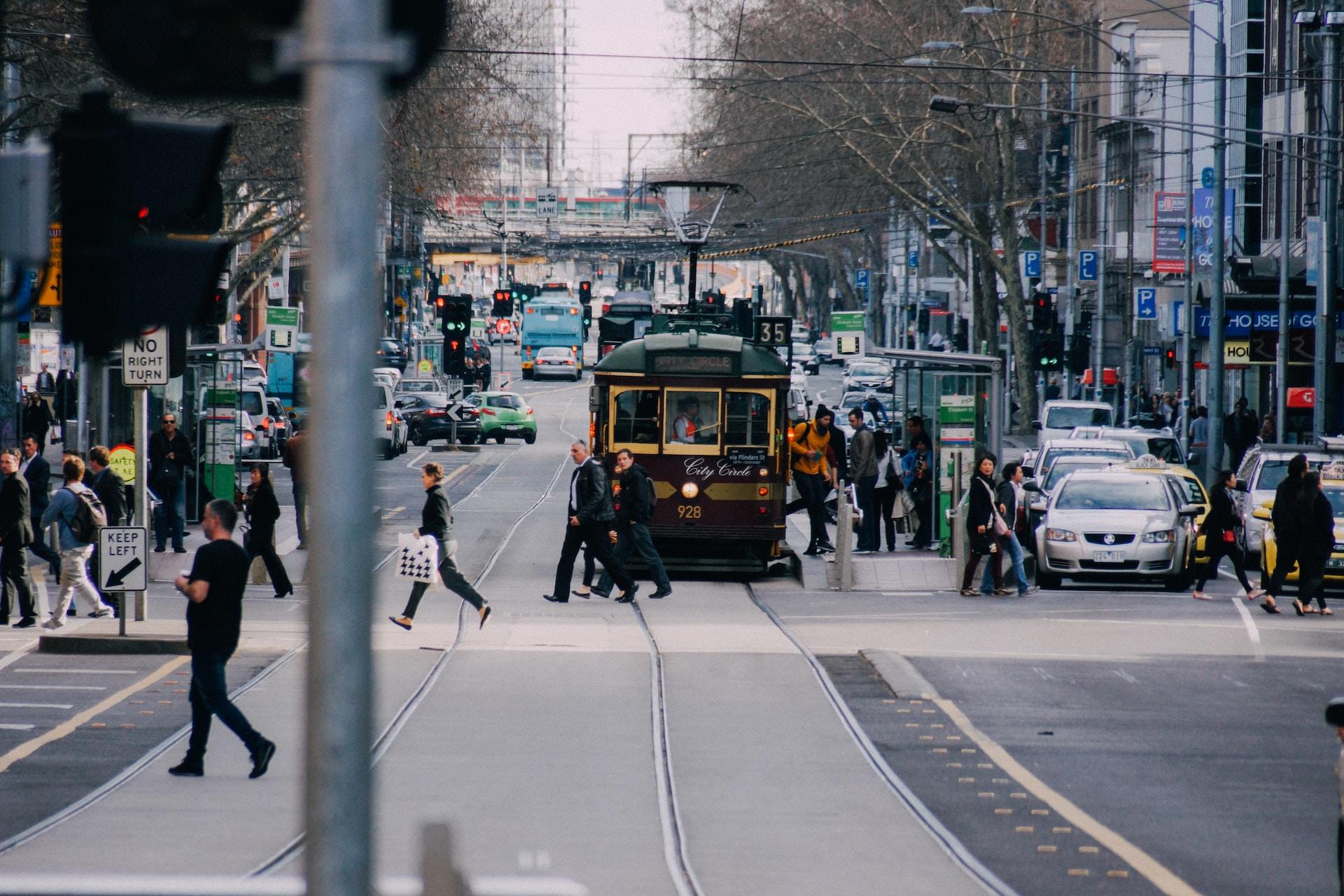 A junction for trams, cars, and pedestrians in Melbourne, Australia.