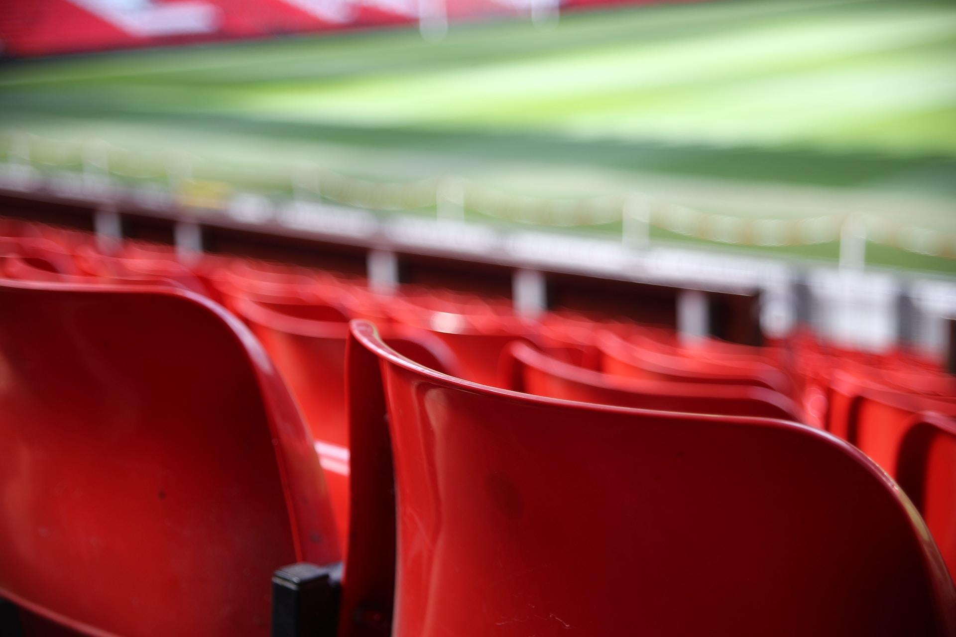 Red seating in a soccer stadium.