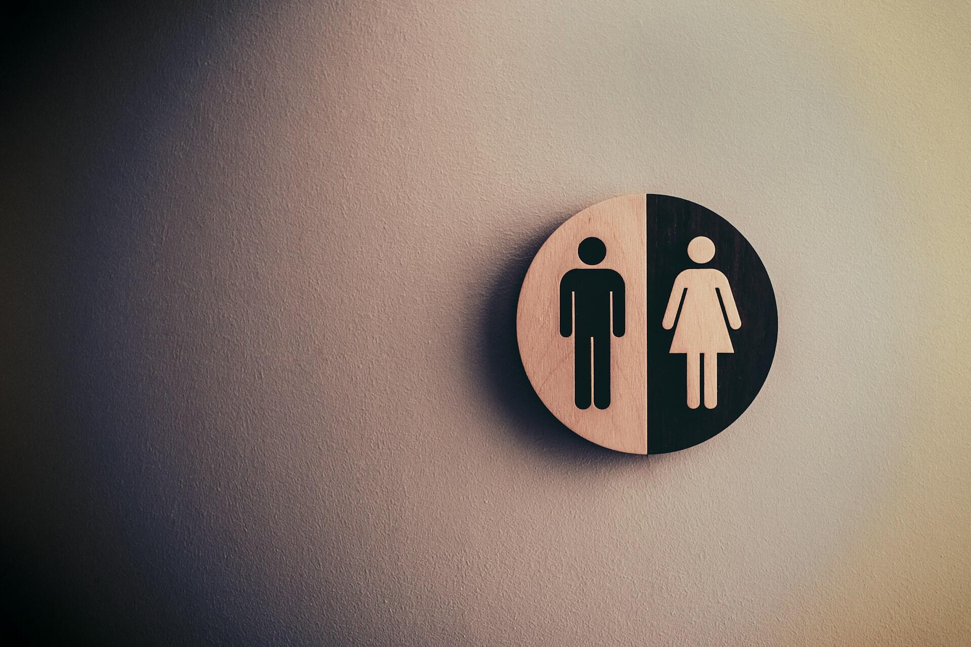 Gender symbol sign showing male and female icons on a wall