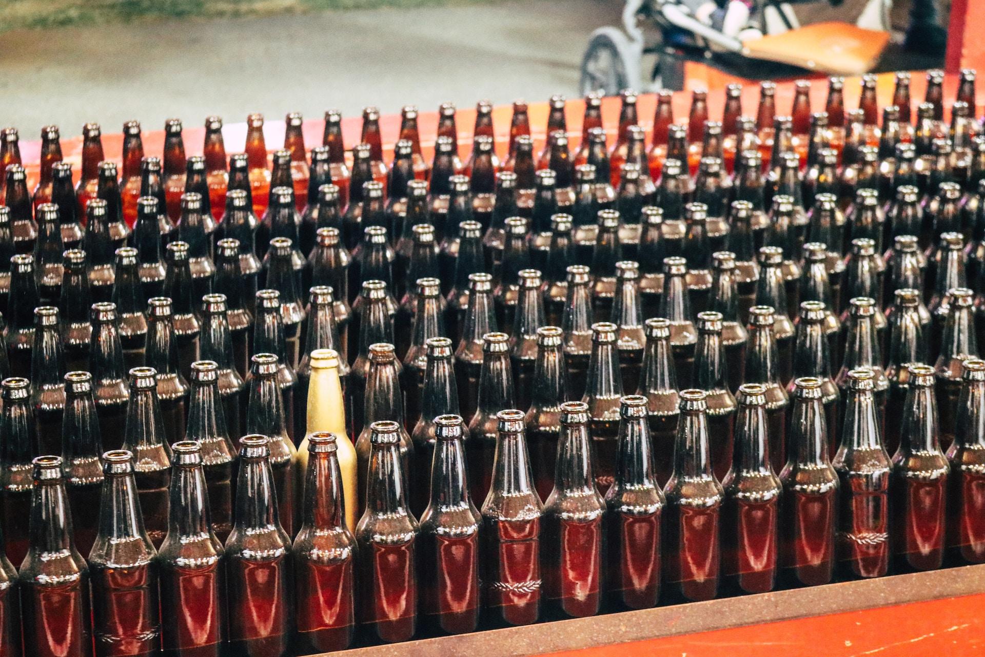 A view of several bottles with one a different colour.