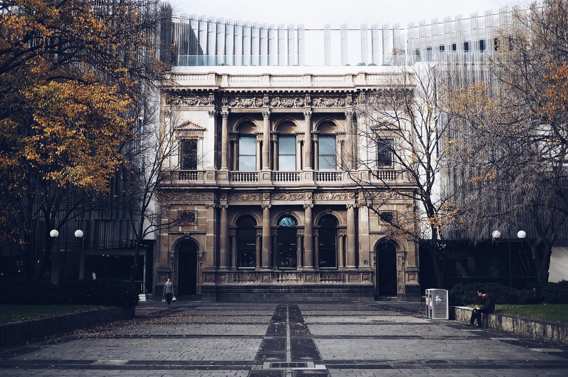 The University of Melbourne's stone entrance on a winter day.