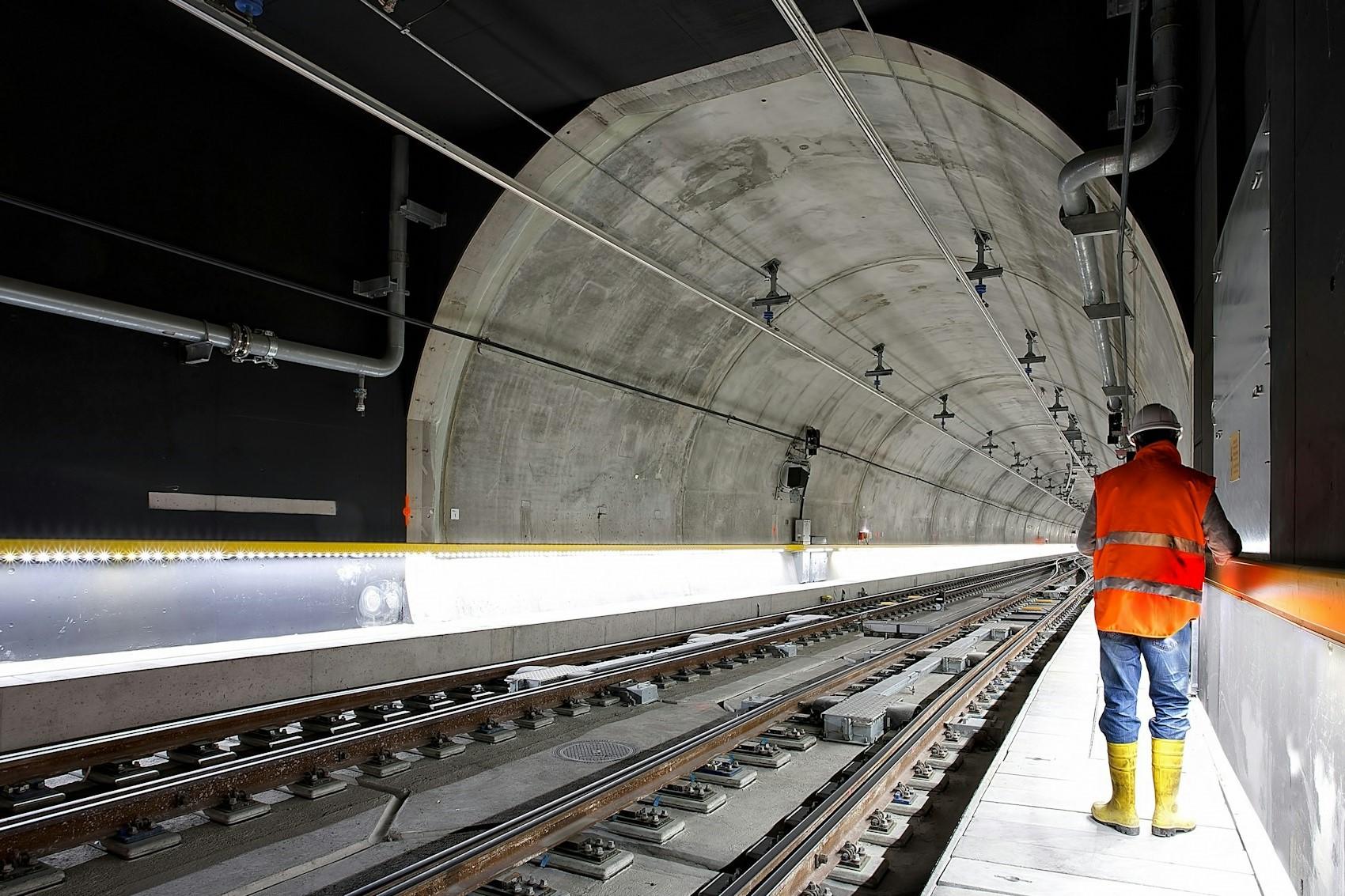 An engineer standing in a tunnel.