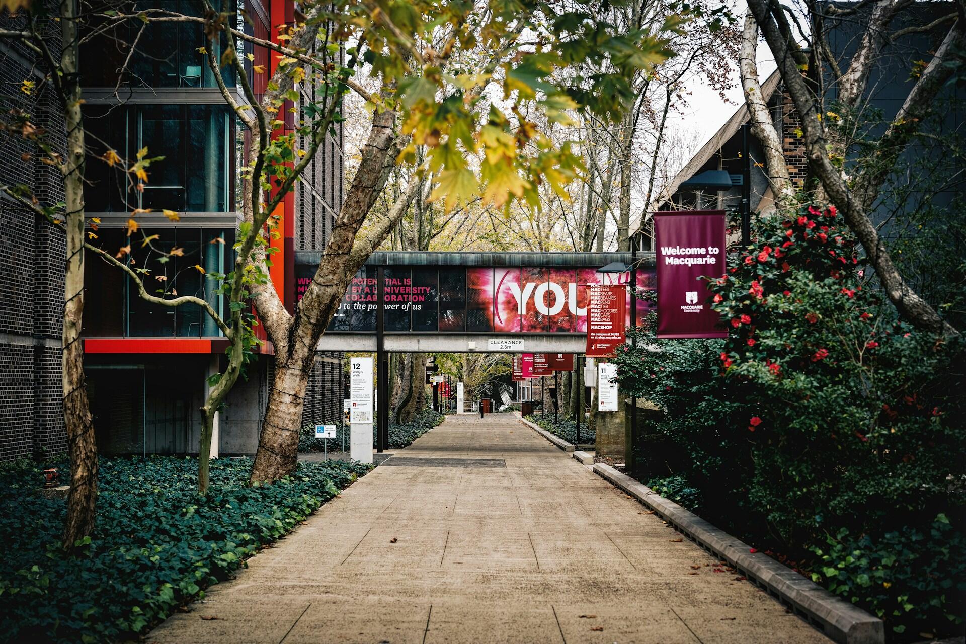 An outdoor walkway with buildings on either side.