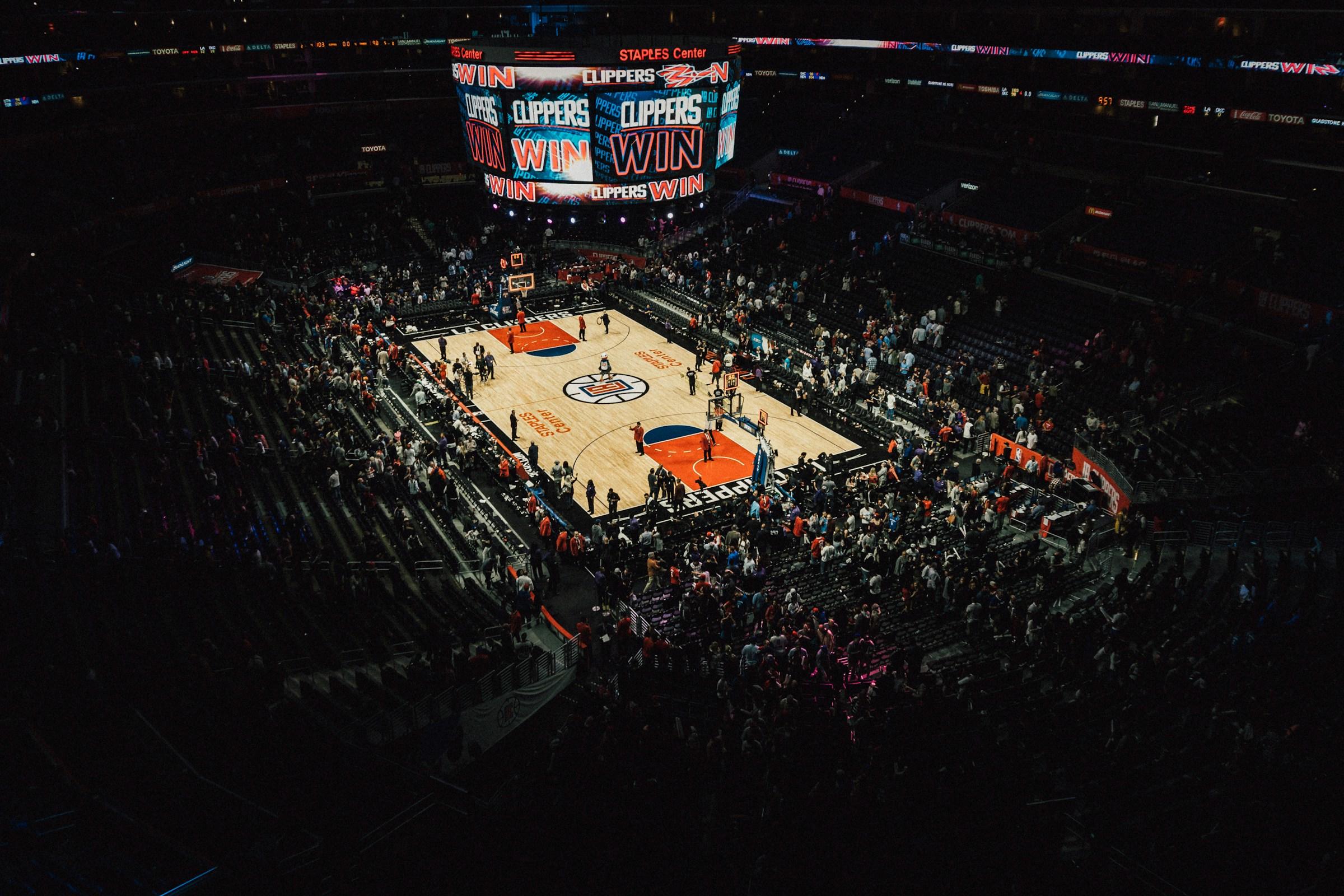 A photo of the Staples Center arena in Los Angeles with a celebration about the LA Clippers on the Jumbotron
