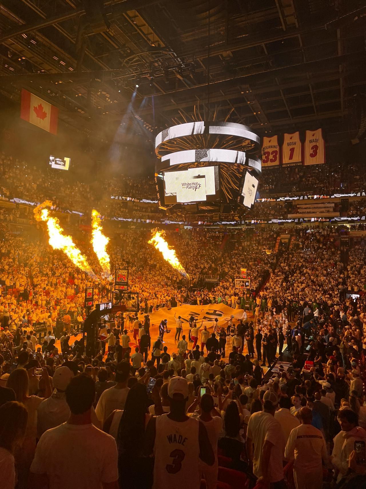 At the Miami Heat game, stage flames are used to excite the crowd