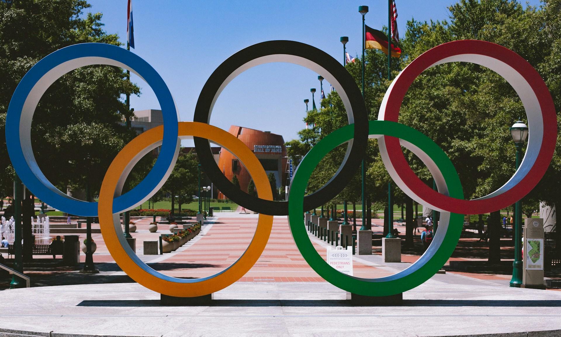 Olympic rings displayed at the entrance of a stadium