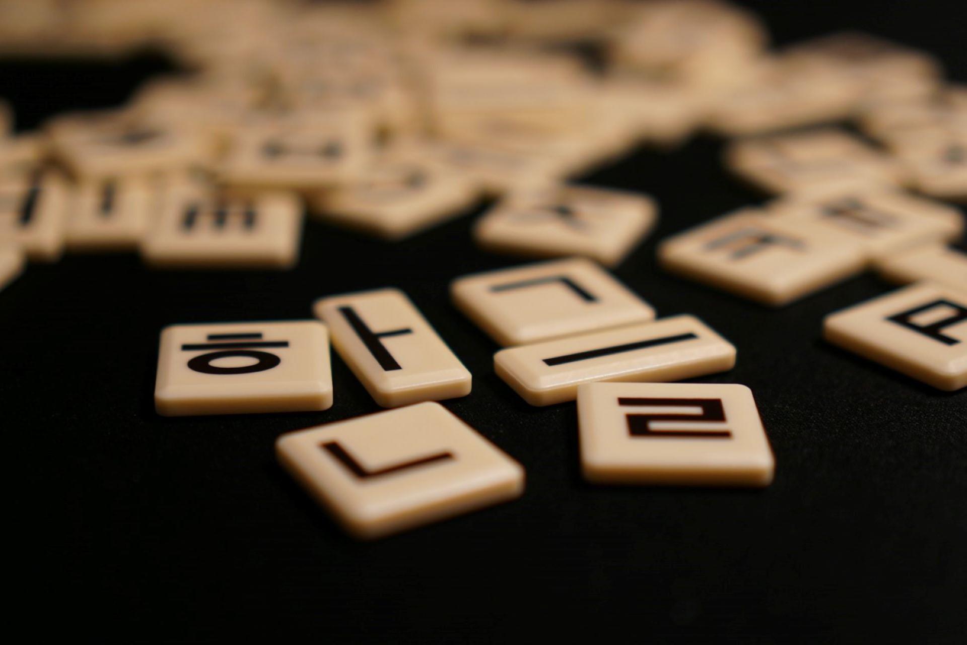 A closeup of Korean Hangul Scrabble tiles.