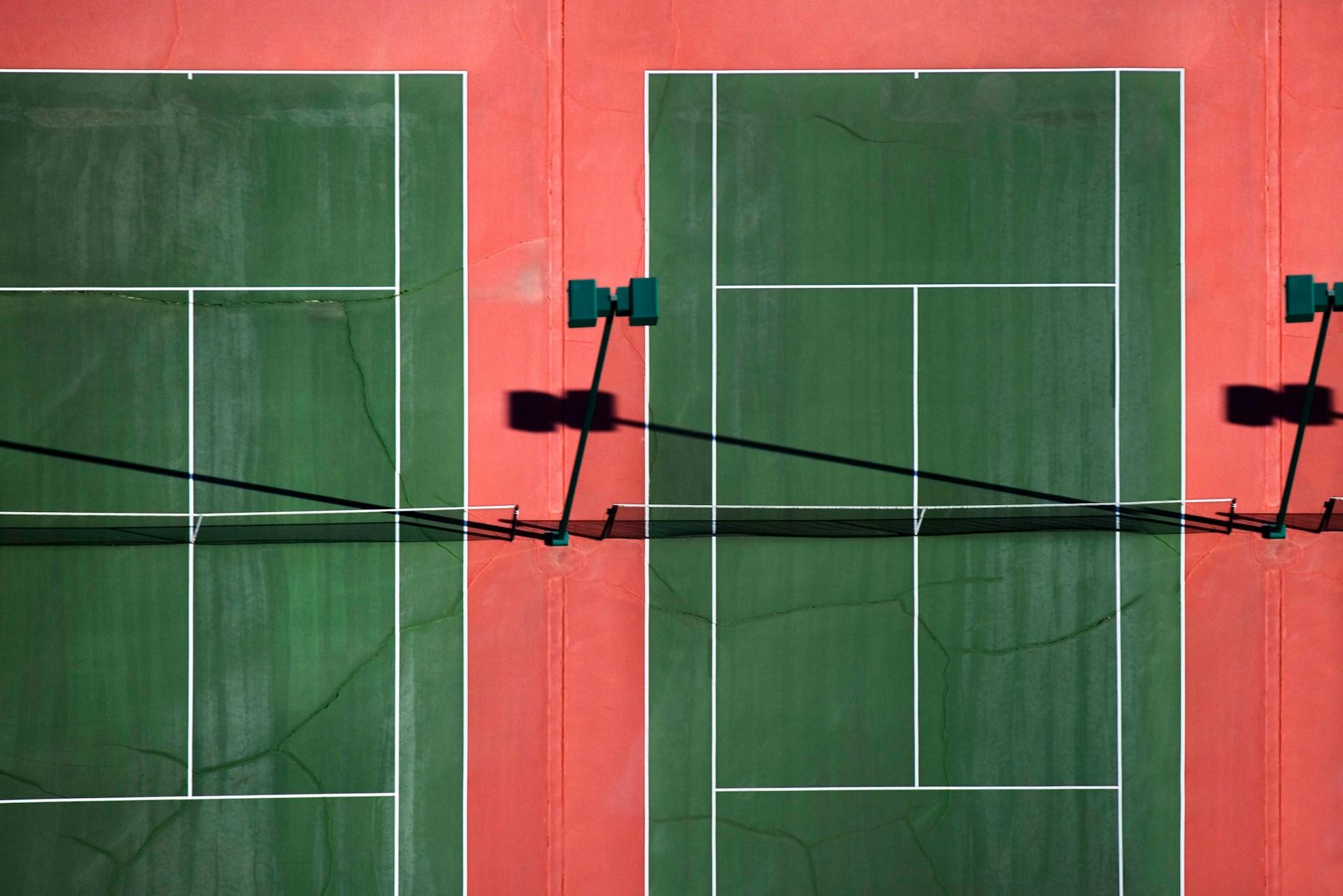 Tennis court with dual green lines.