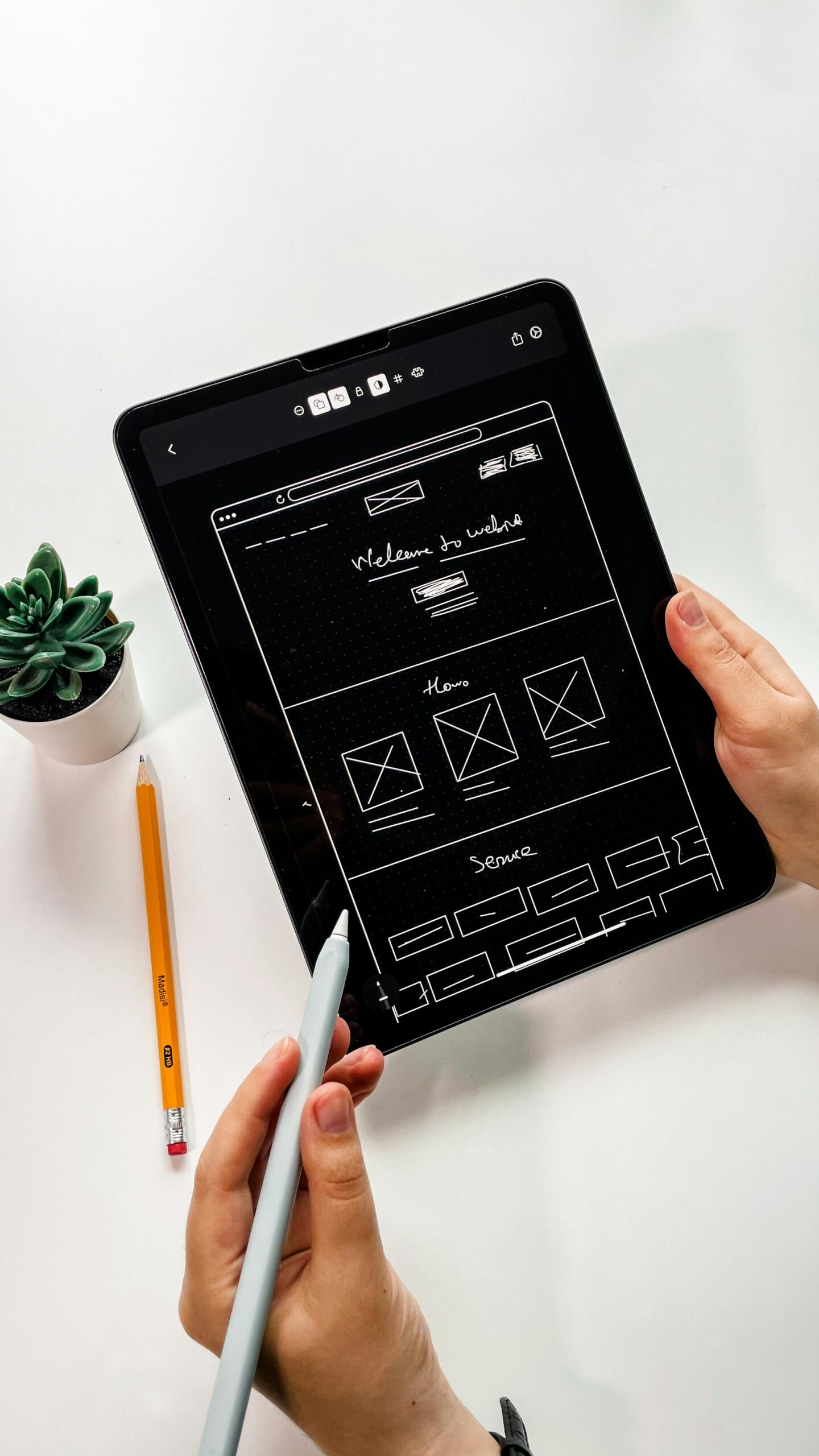 A UX designer working on a tablet.