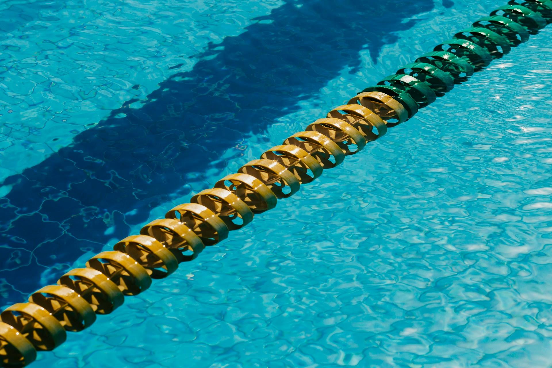 A pool lane separator floating on the water.