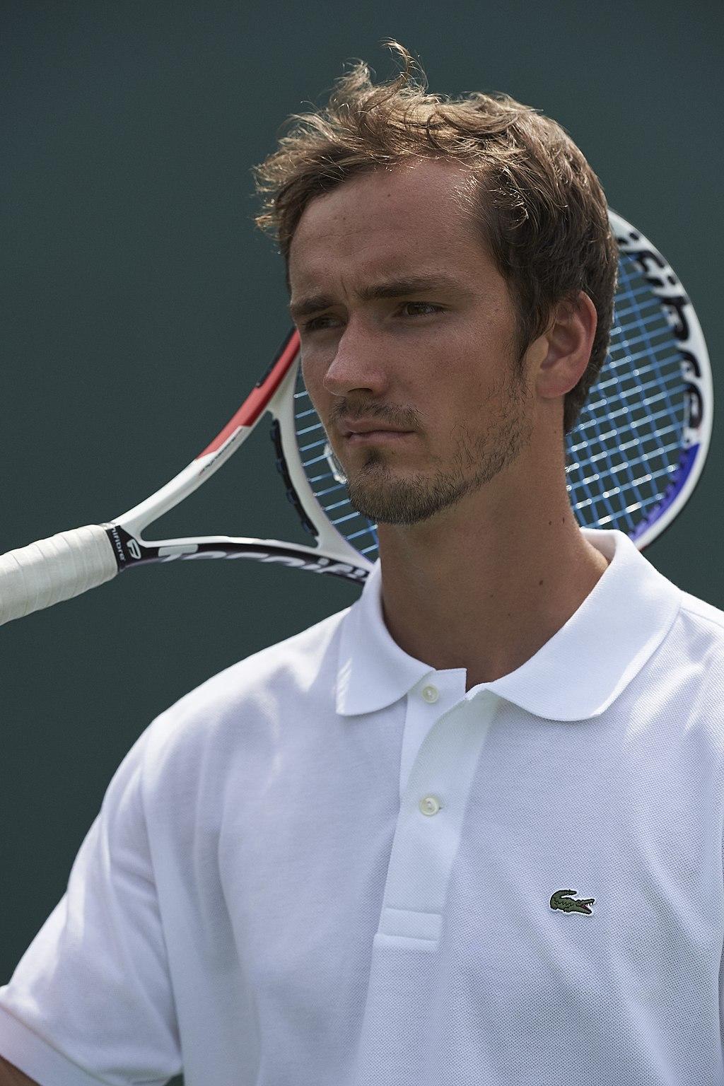 Close-up shot of Daniil Medvedev holding a tennis racket.