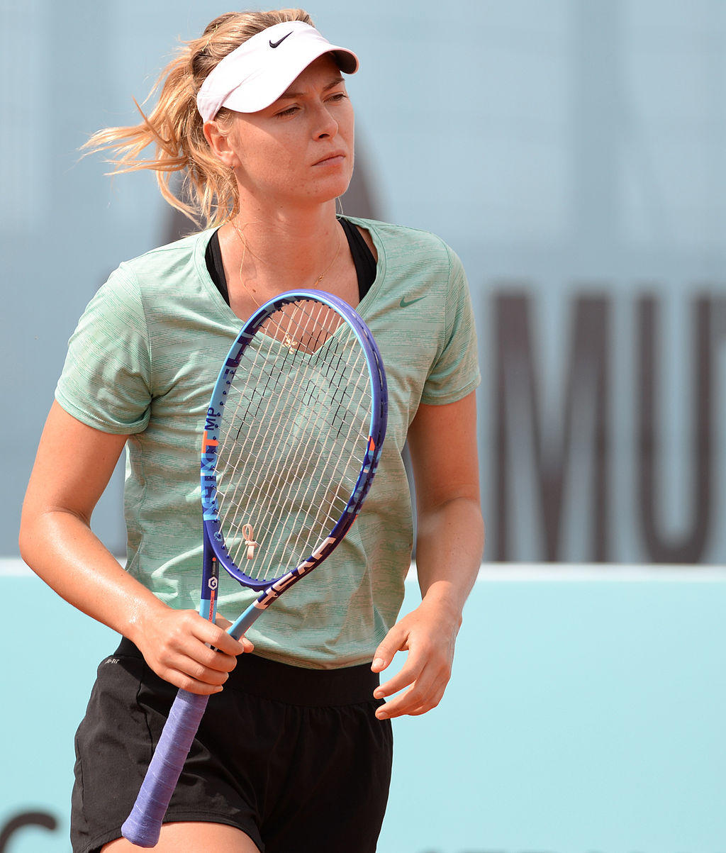 Maria Sharapova in athletic attire holding a tennis racket.