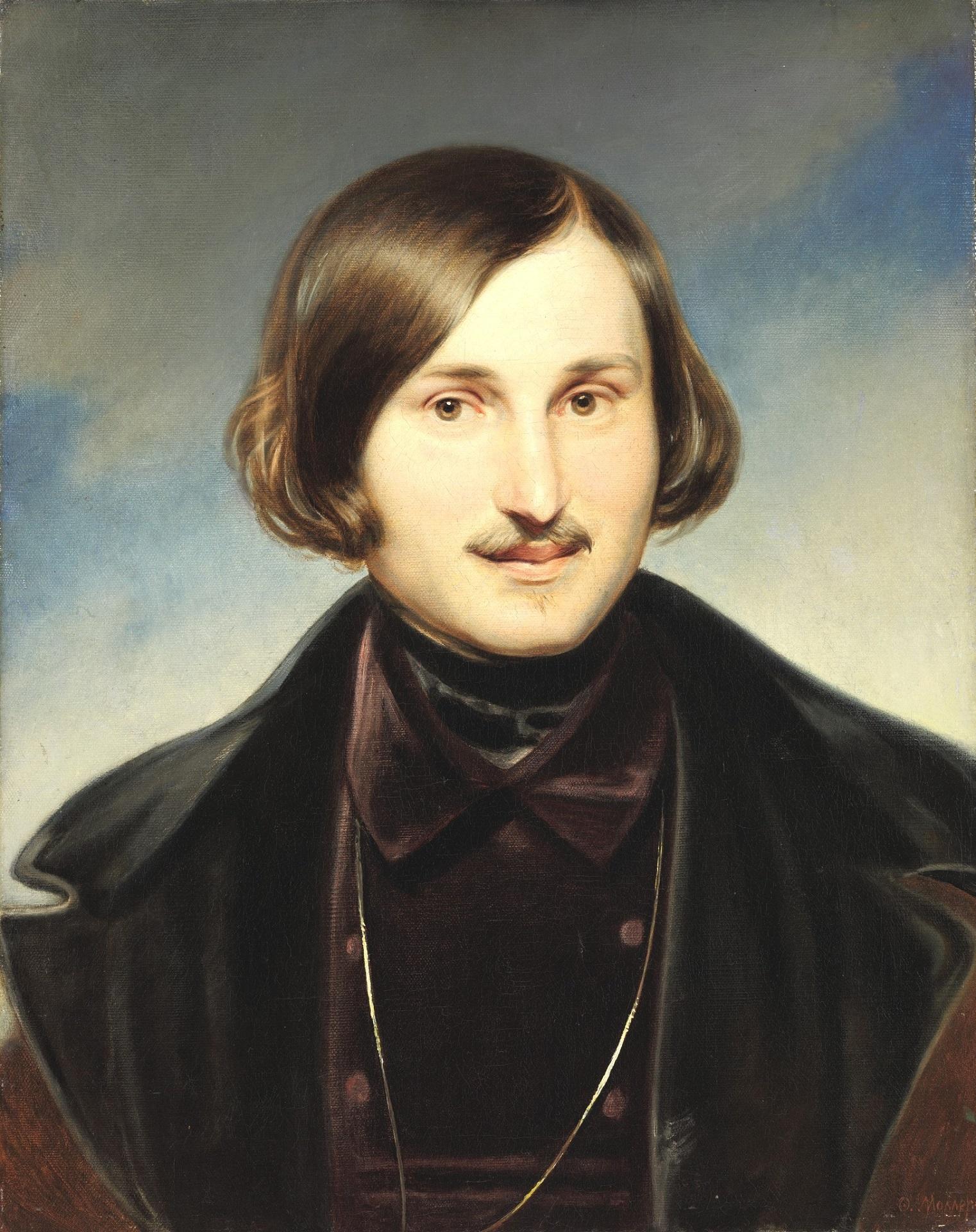 A portrait of a man with slightly long hair and a mustache, wearing dark clothing, against a blue and white background.