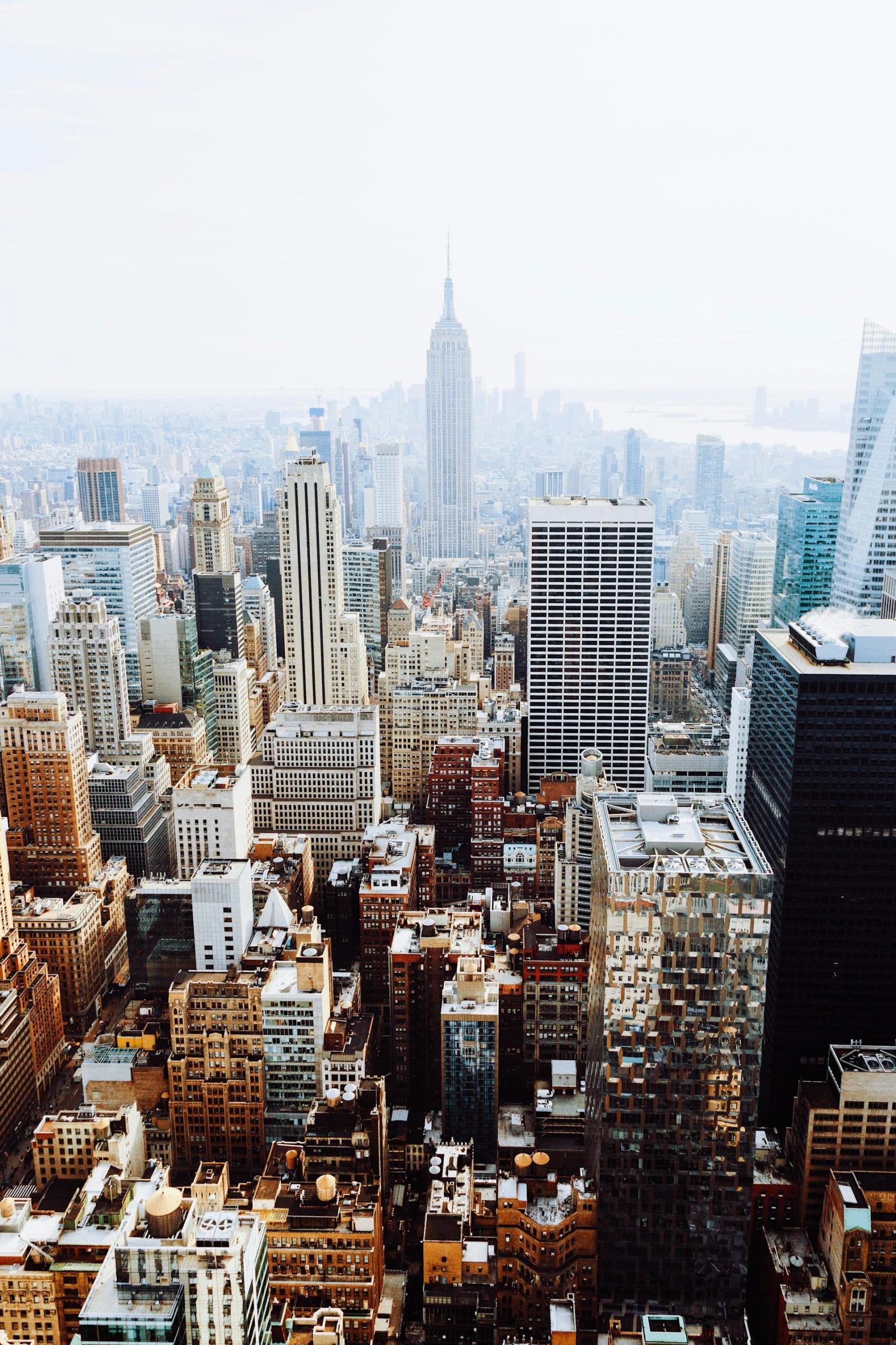 The New York City skyline under a hazy sky. 