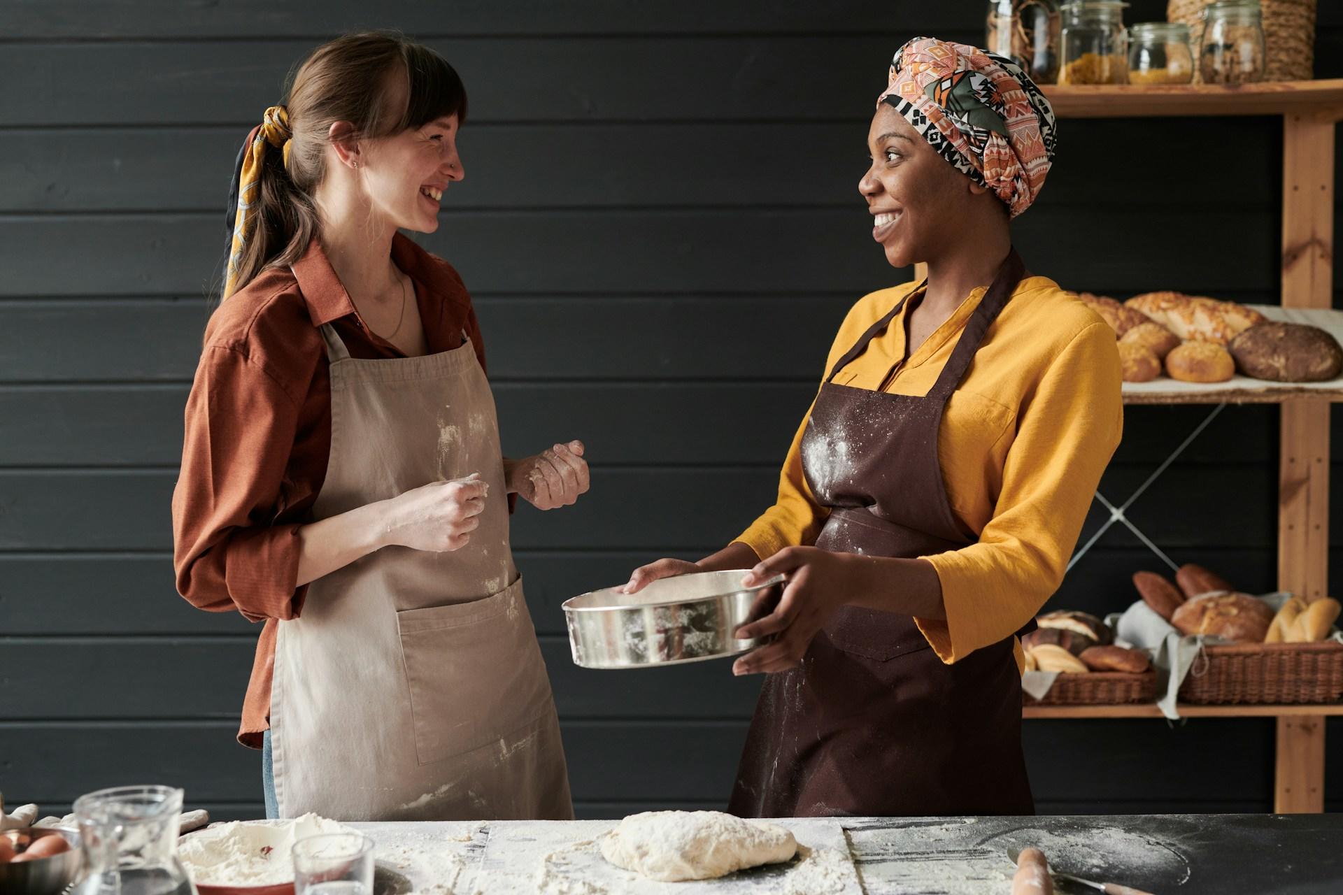 Two women baking together in the kitchen.