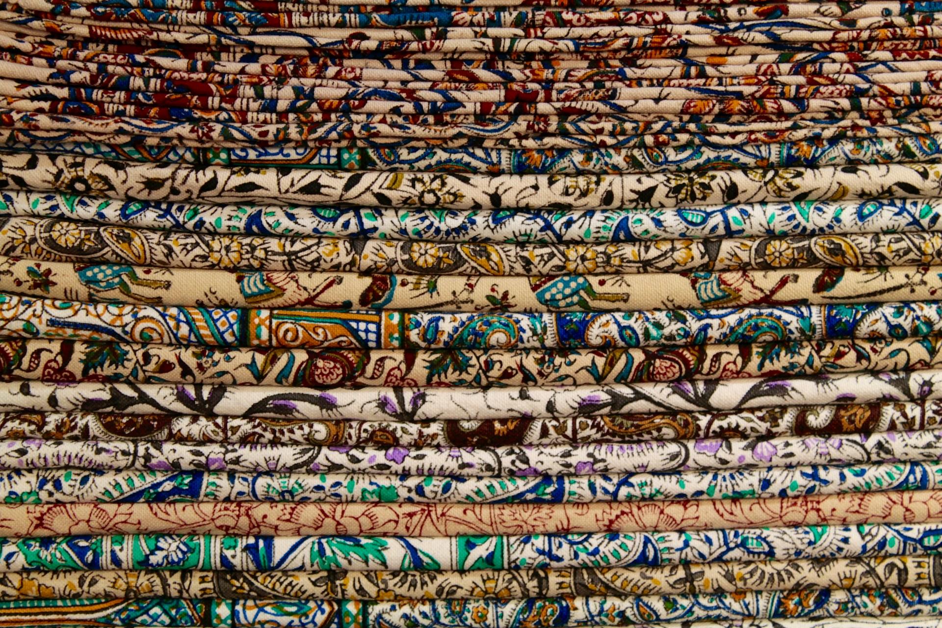 A variety of fabrics in a pile.