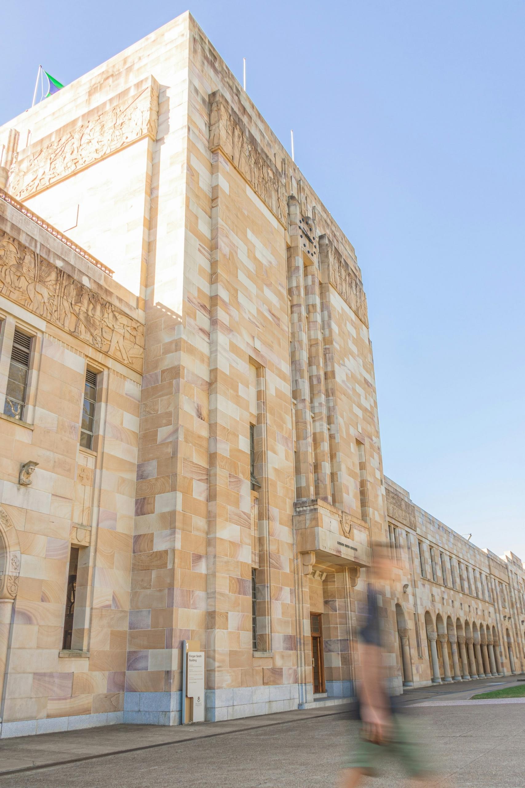 A sandstone building on a sunny day. 