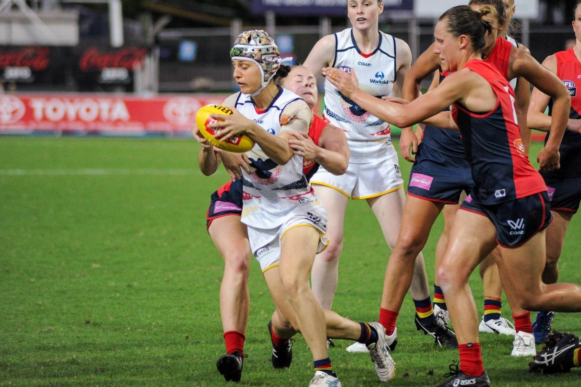 Emma Humphries tackling Heather Anderson during the AFL Women's round six match between Adelaide and Melbourne on 11 March 2017 at TIO Stadium in Darwin, Northern Territory