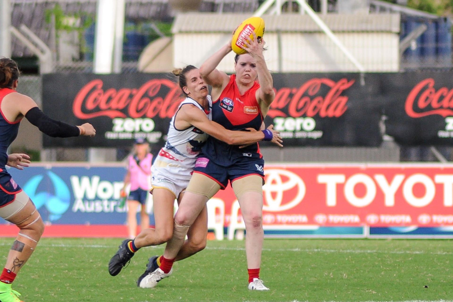 Chelsea Randall tackling Elise O'Dea during the AFL Women's round six match between Adelaide and Melbourne on 11 March 2017 at TIO Stadium in Darwin, Northern Territory