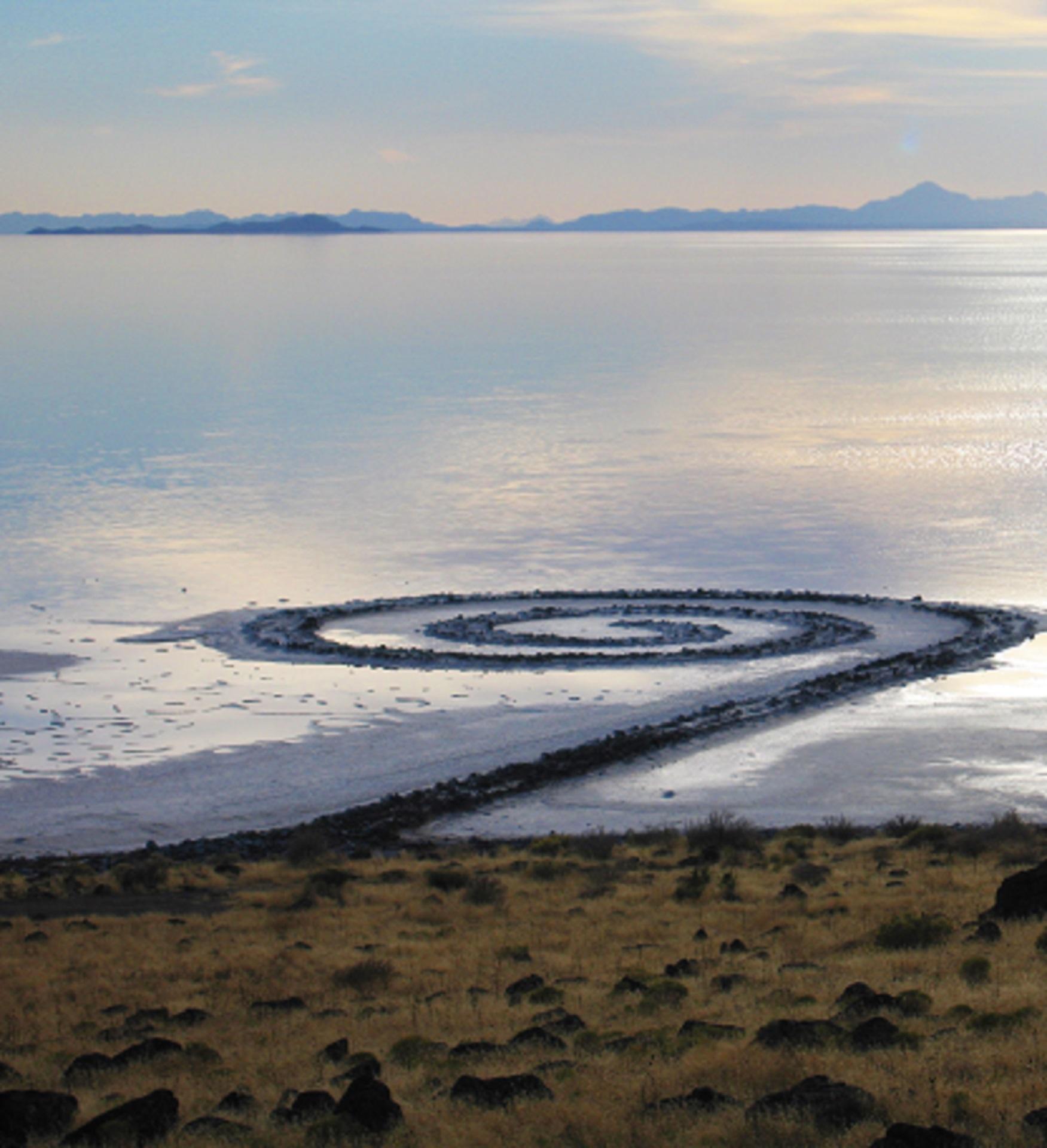 A spiral in a lake at sunset.