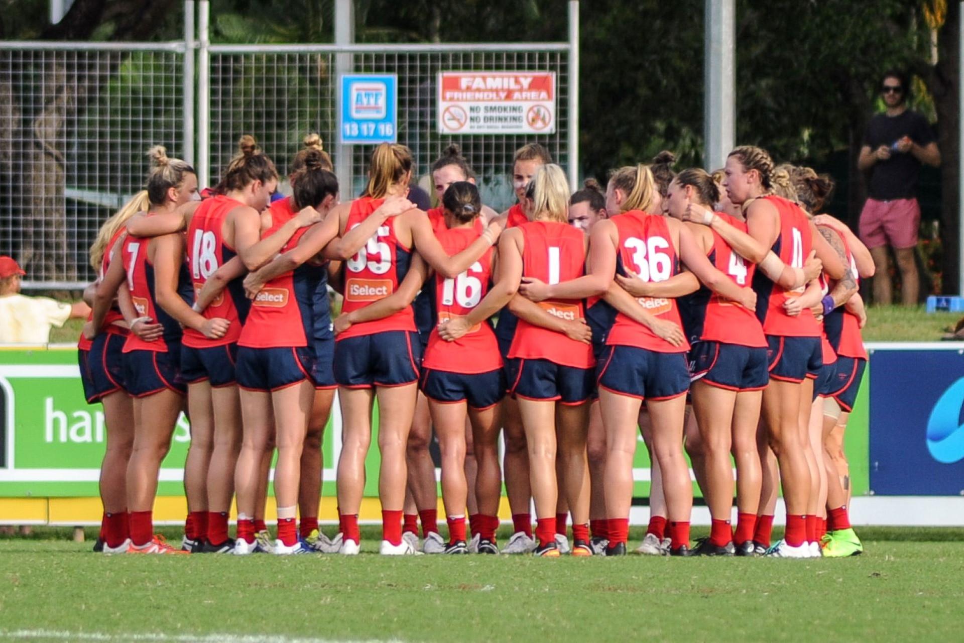 Melbourne AFL Women's team huddle prior to the round six match against Adelaide at TIO Stadium.
