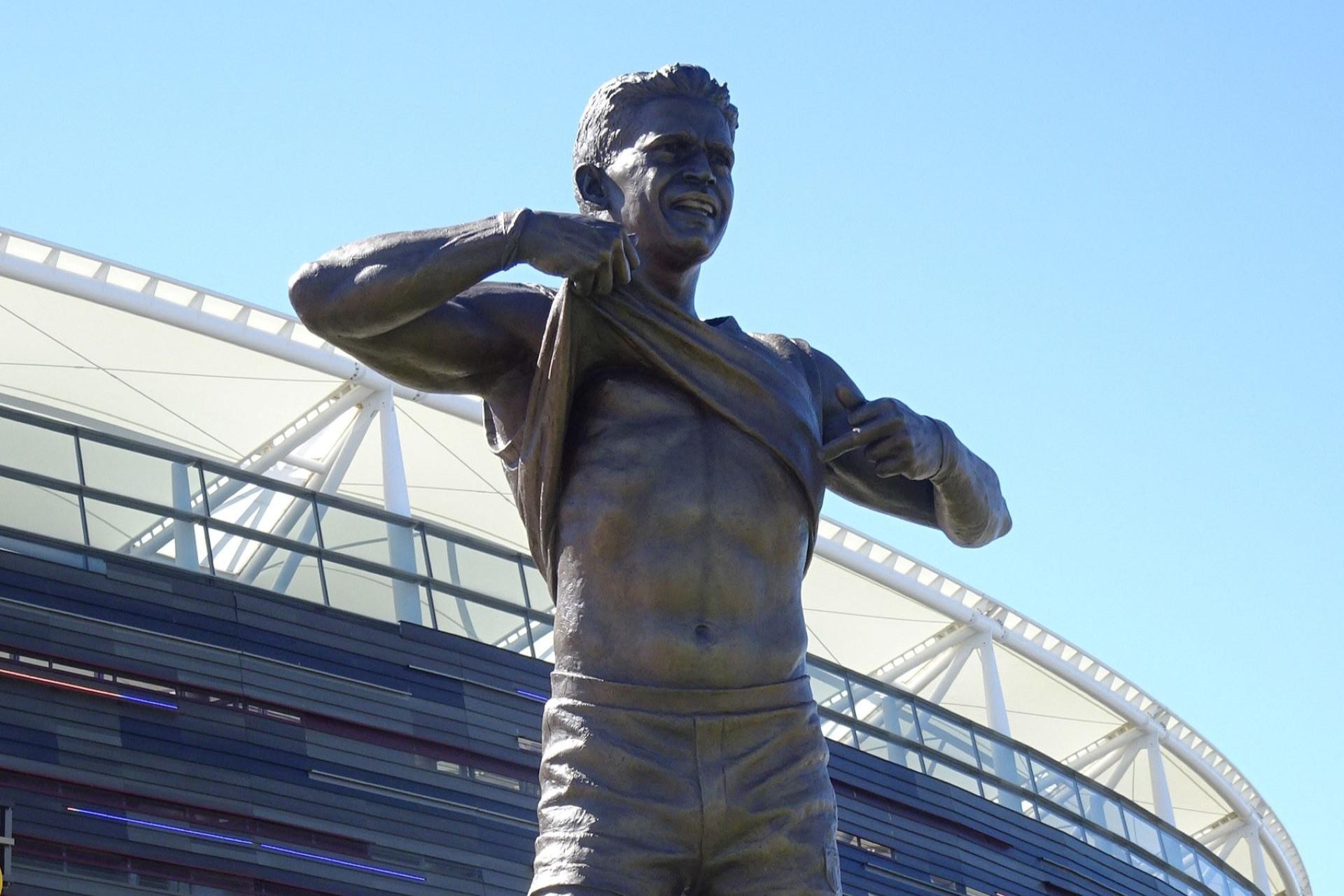 A statue of Aboriginal footy player Nicky Winmar.
