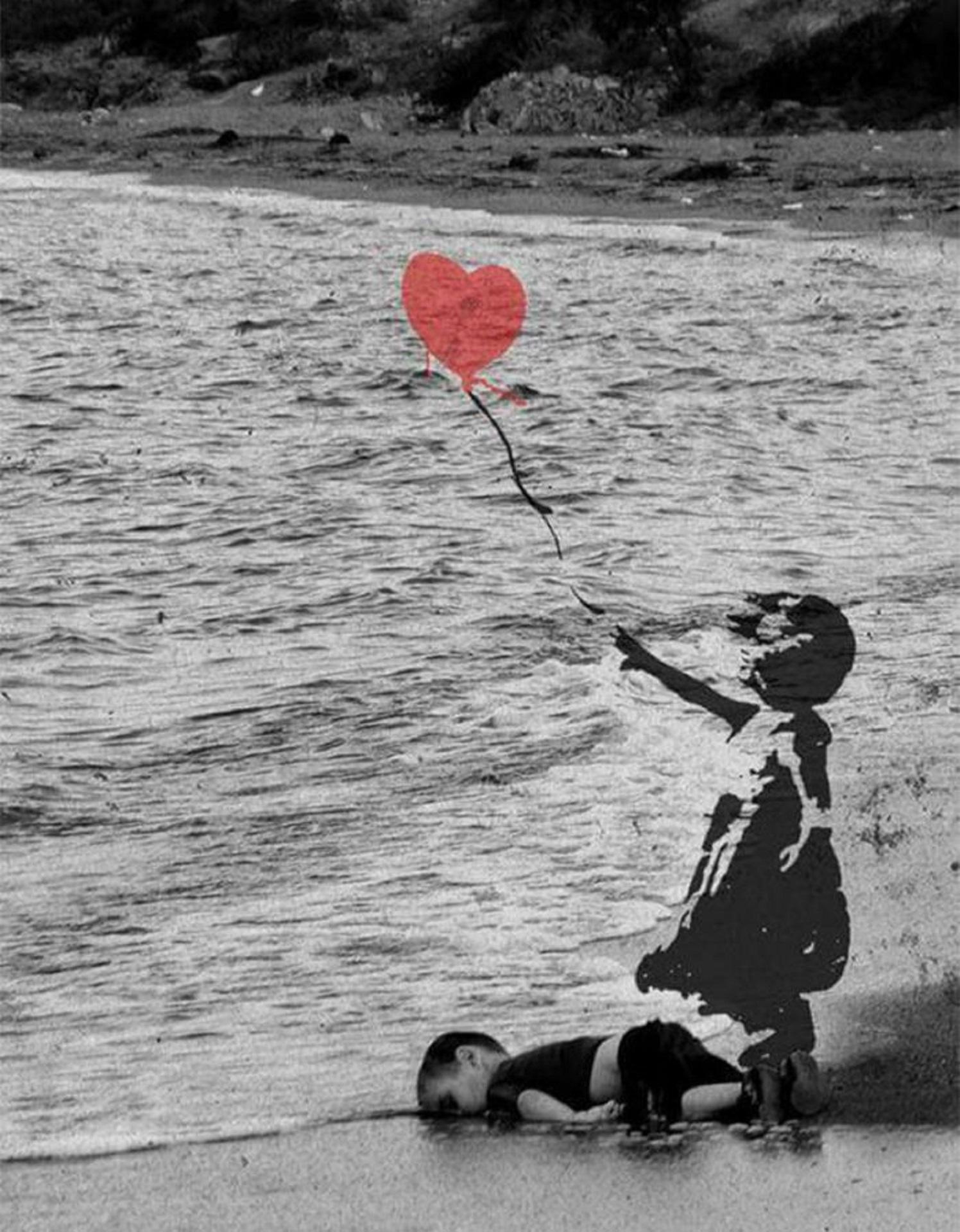 A greyscale of a child on laying facedown on the beach with a girl releasing a heart balloon above him.