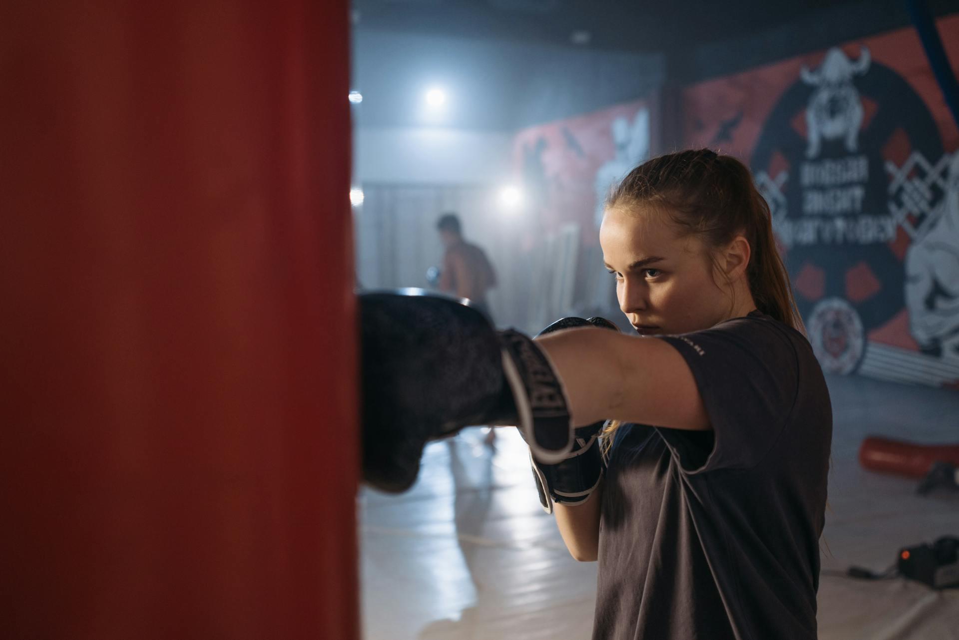 woman punching a punching bag