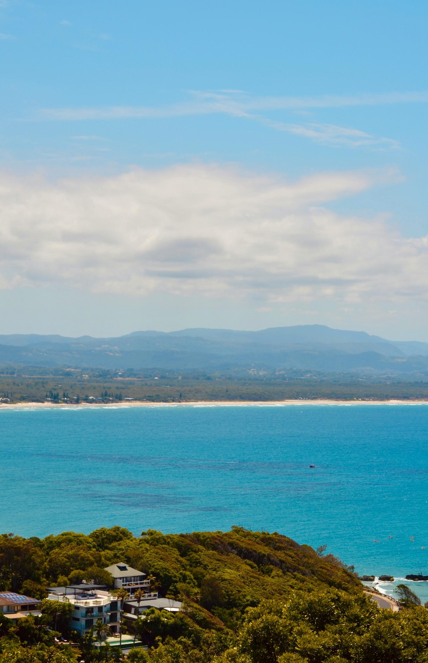 Water and a distant shoreline on a cloudy day.