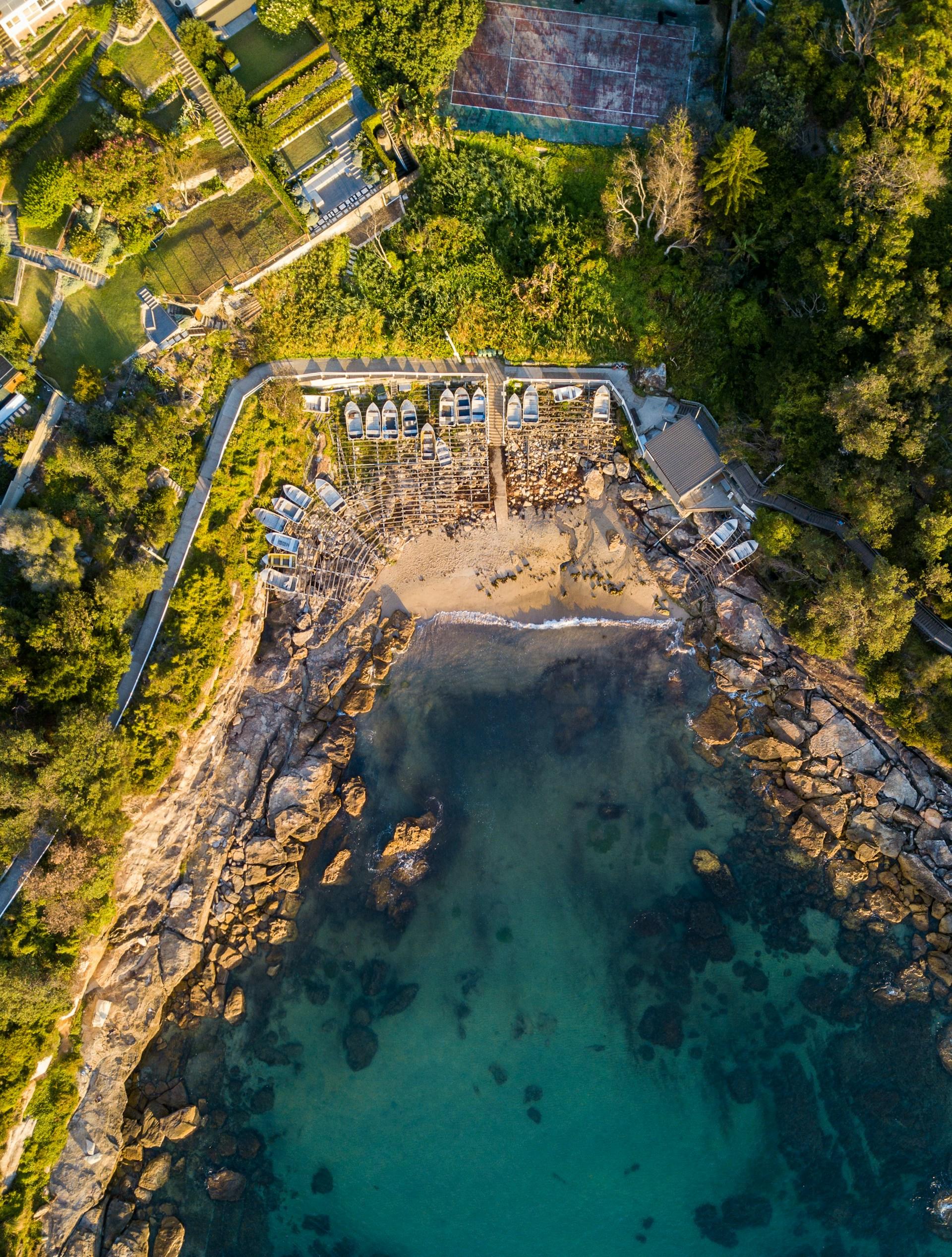 A aerial view of a bay and the land around it on a sunny day. 