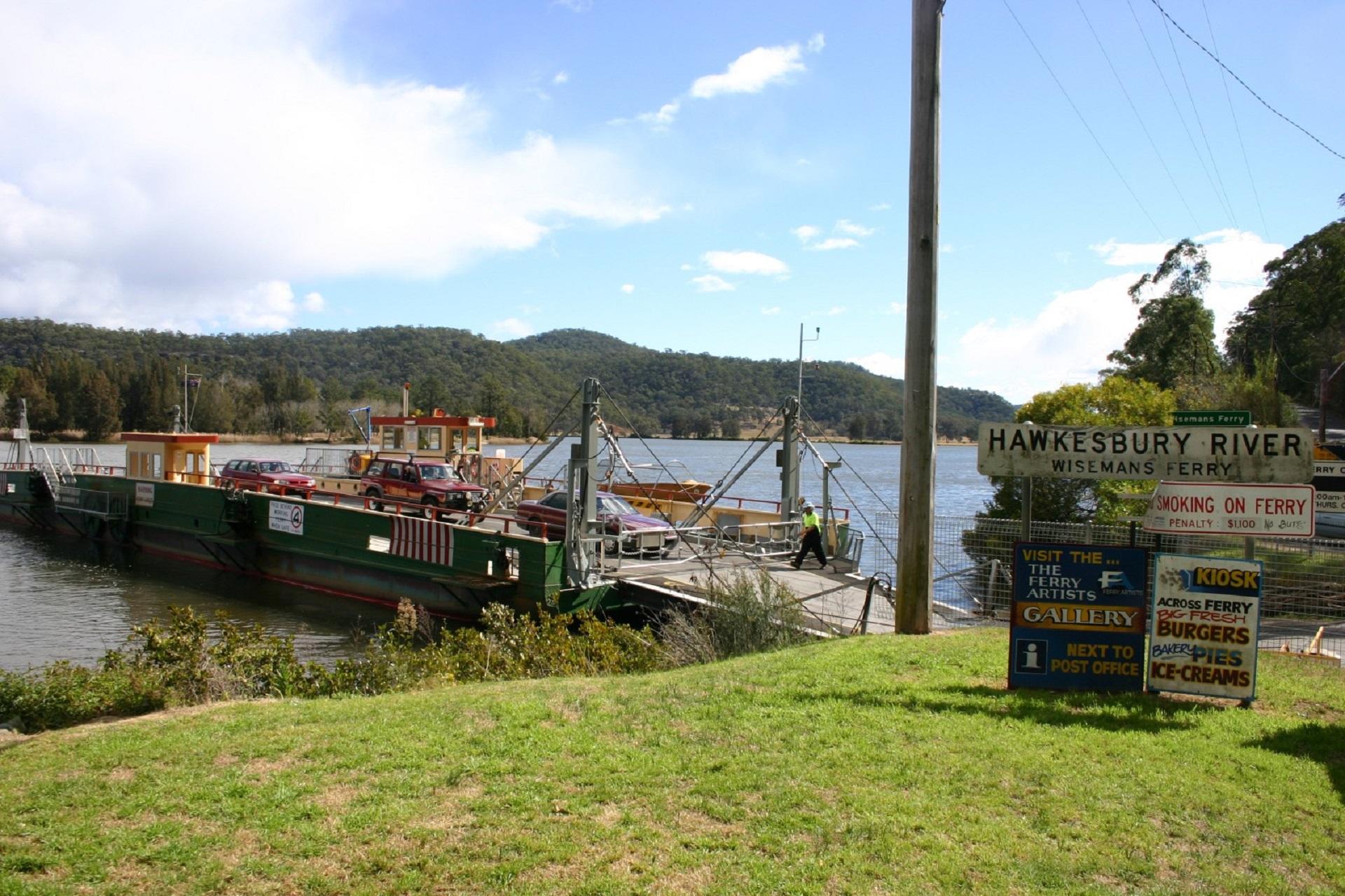 A ferry at its dock on a sunny day. 