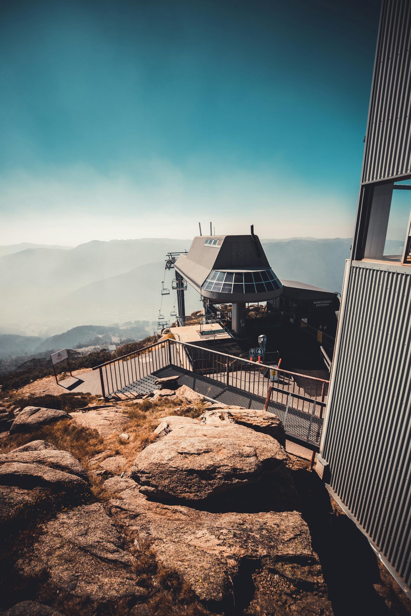 A lookout atop a mountain on a sunny day. 