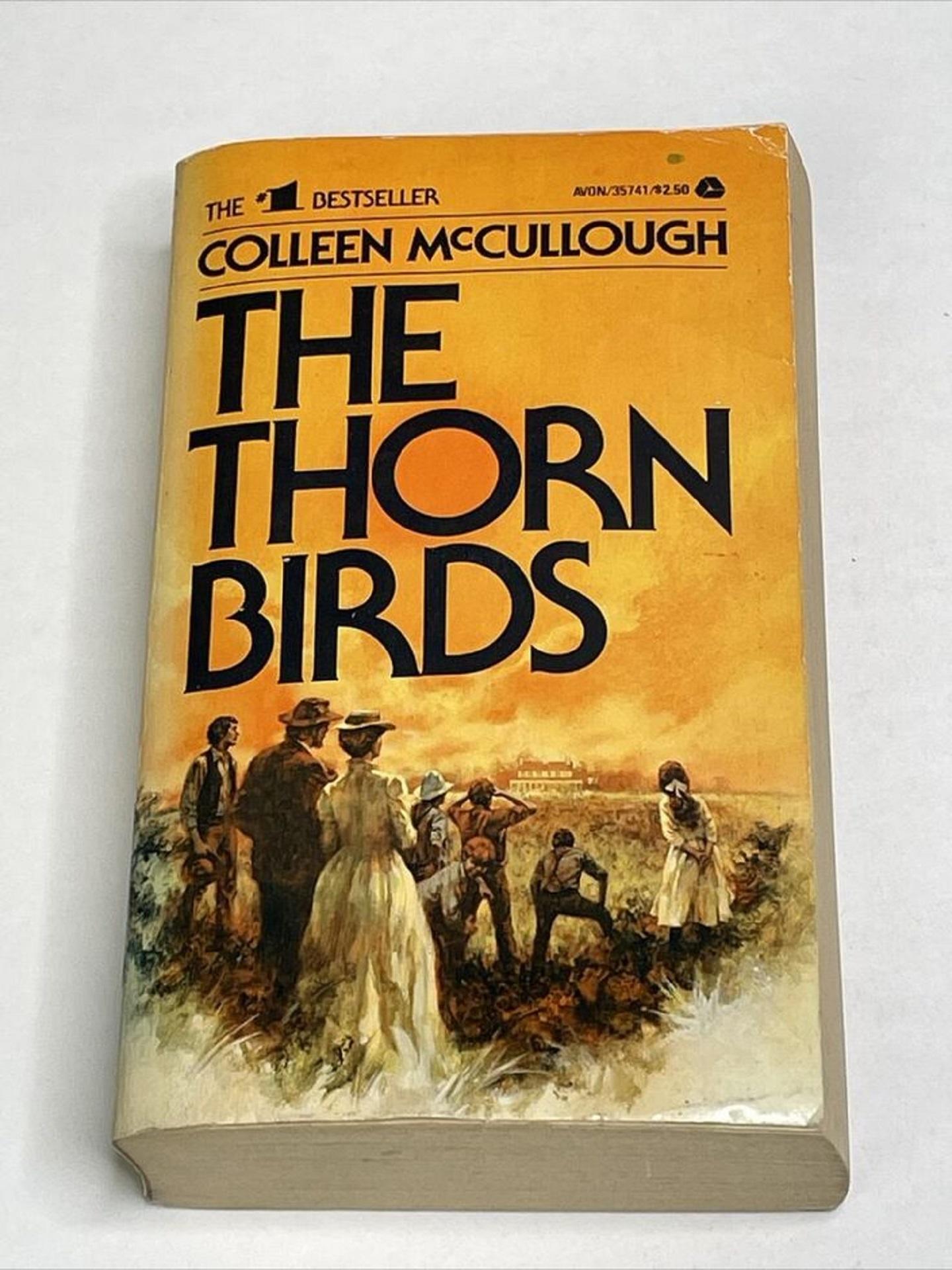 A book with a golden cover and black writing.