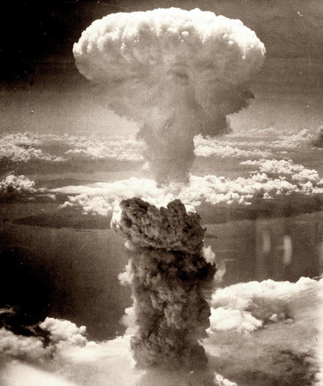 A sepia-toned image of a mushroom cloud.