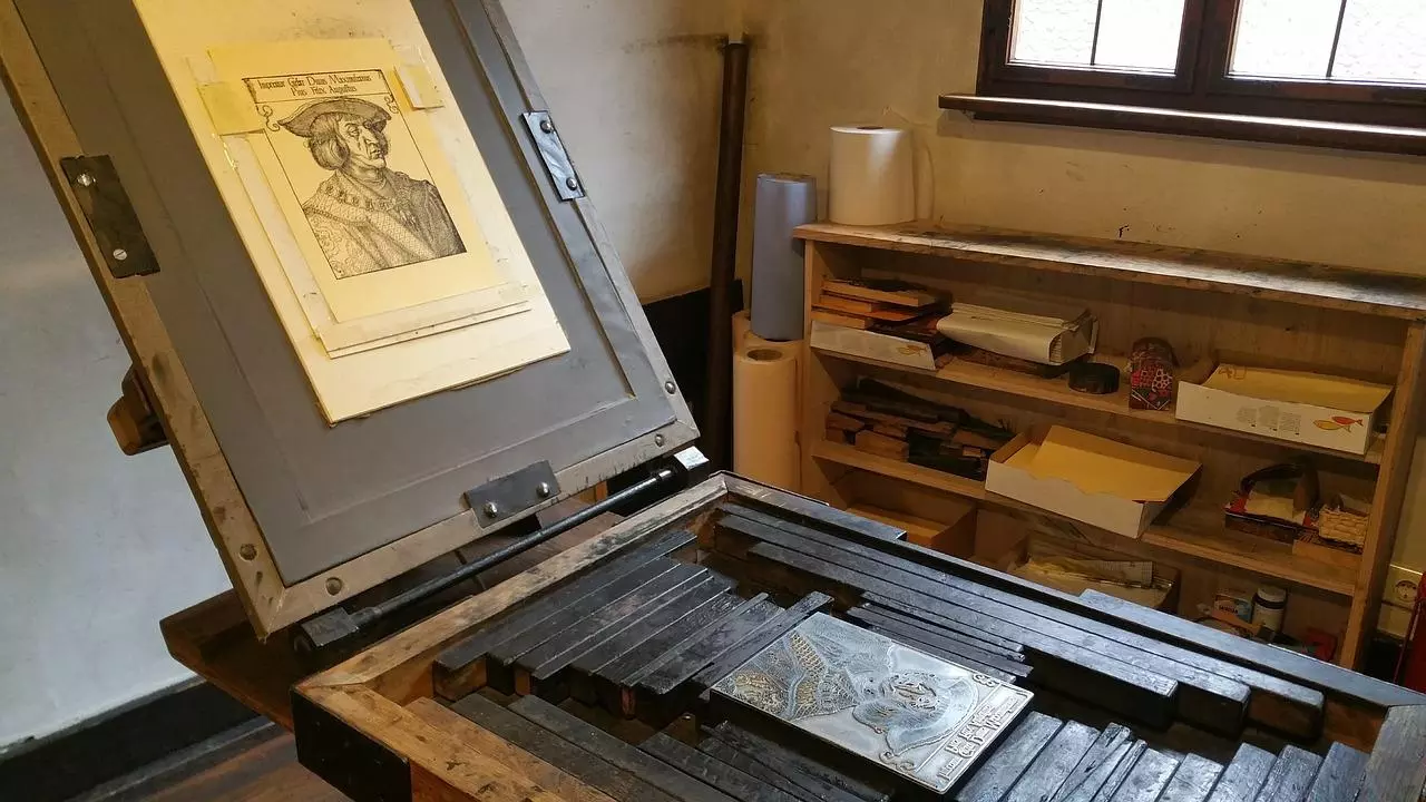 A large wooden printing press displaying a large print.