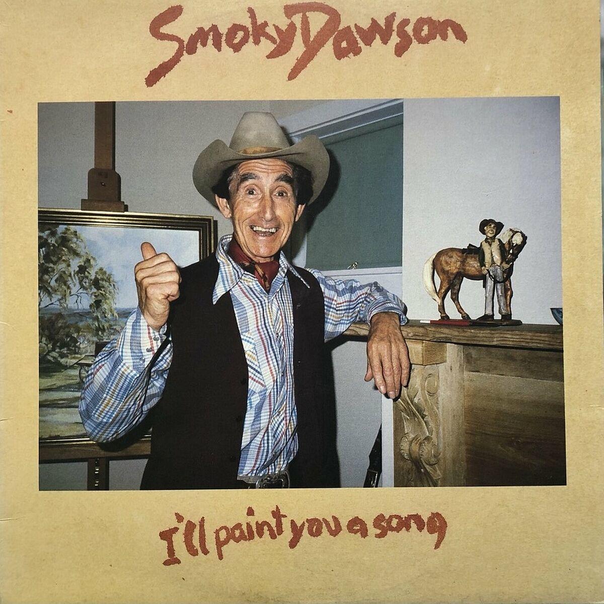 "I'll Paint You A Song" album cover. It's tan with red letters and a rectangular photo of Smoky in the middle, wearing cowboy clothes and giving a thumbs up