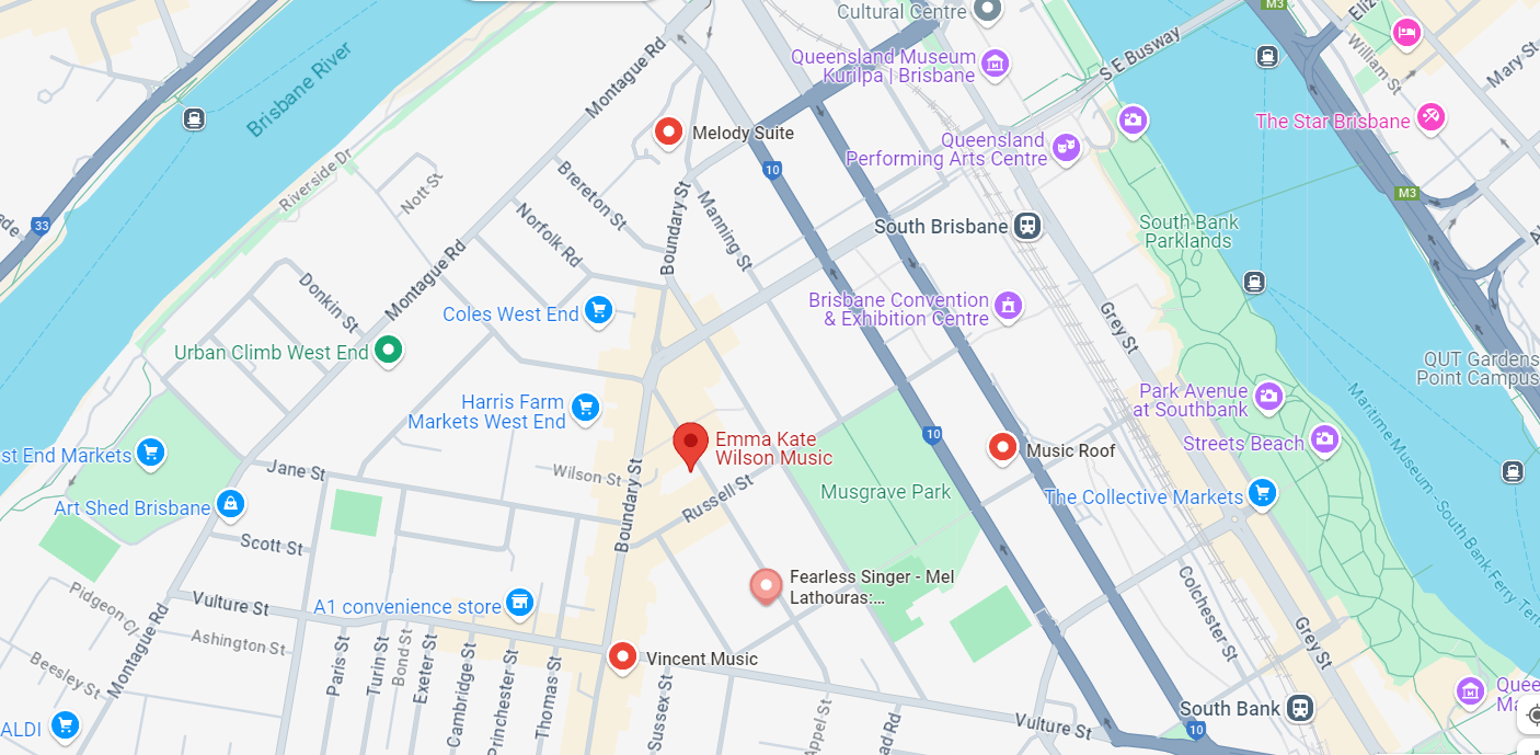 A city map showing two legs of a river around a spit of land, and a red marker in the middle. 