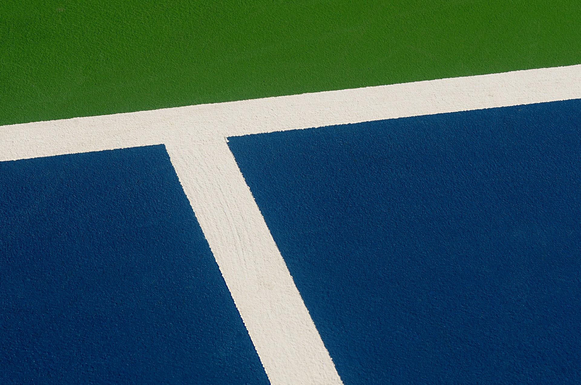A closeup of a tennis hard court.