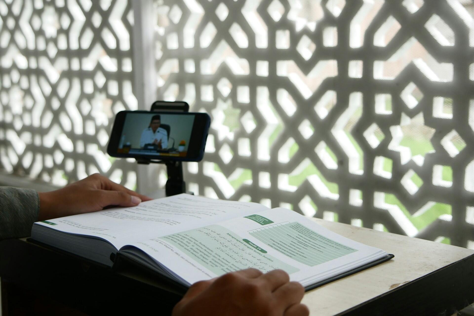 A person studying with an online tutor.