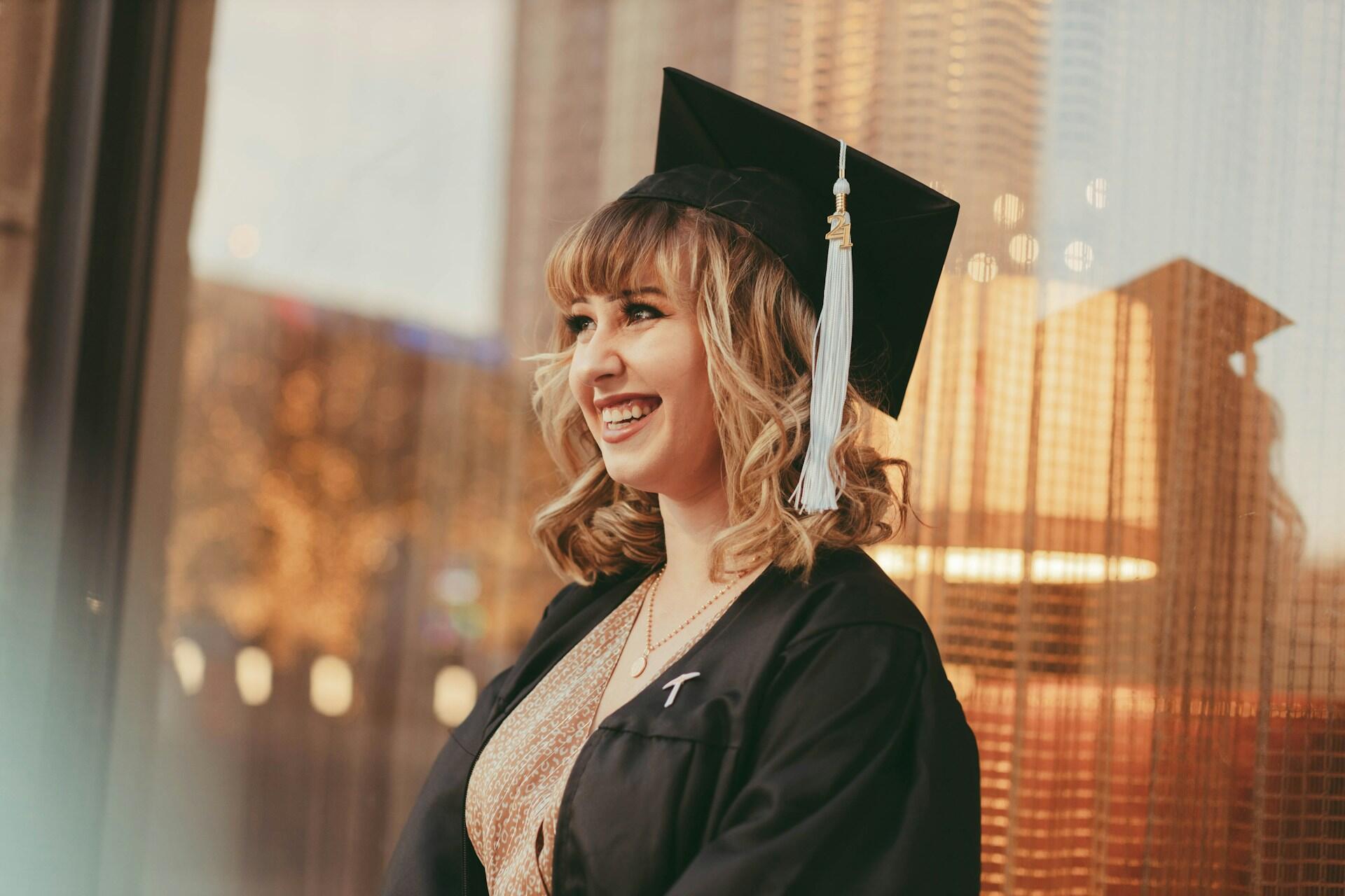 A student in graduate's robe and mortarboard hat.