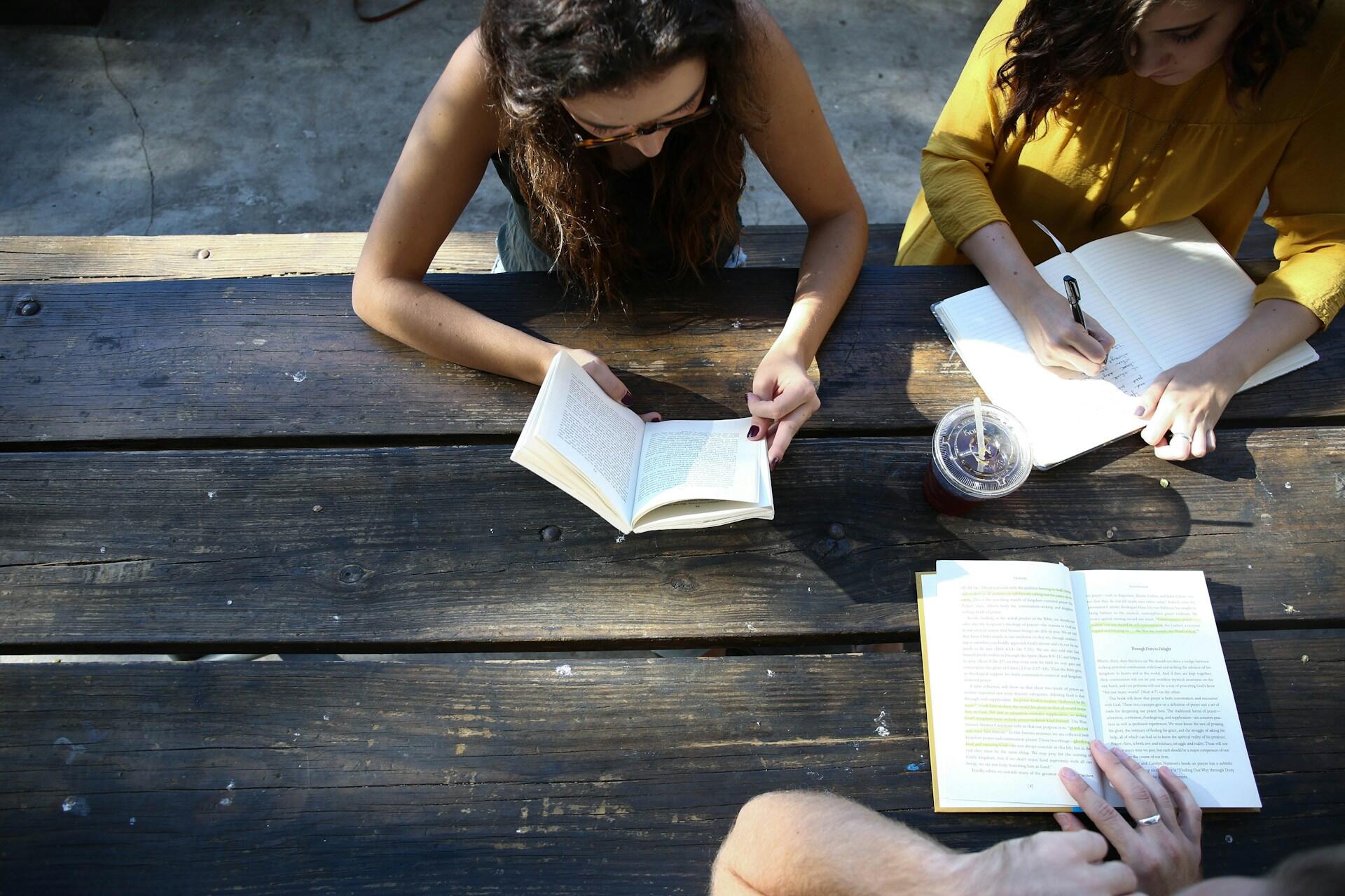 Students studying together outside.