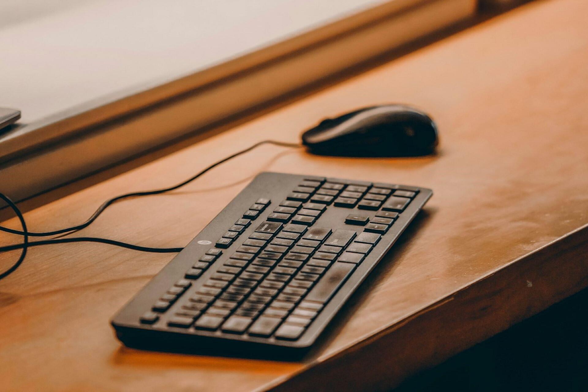 A computer keyboard and laptop.